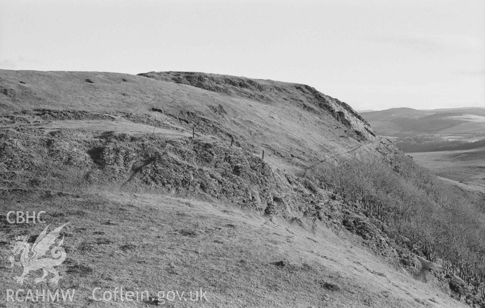 Digital copy of a black and white negative showing panorama of Castell Bwa Drain, with Bwa Drain farm on left and Rheidol Valley on right (photo 3 of 4). Photographed by Arthur Chater on 5 January 1969. Looking north east to south east from Grid Reference SN 712 795.