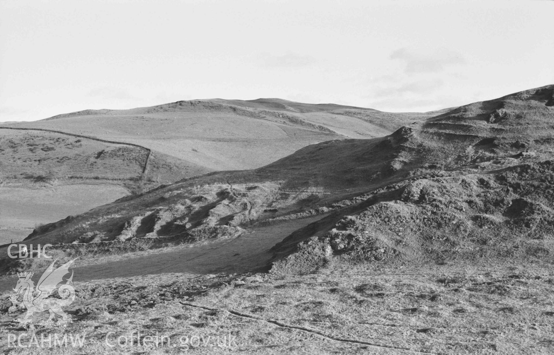 Digital copy of a black and white negative showing Castell Bwa Drain (panorama, photo 1 of 3). Photographed by Arthur Chater on 5 January 1969. Looking east from Grid Reference SN 712 795.