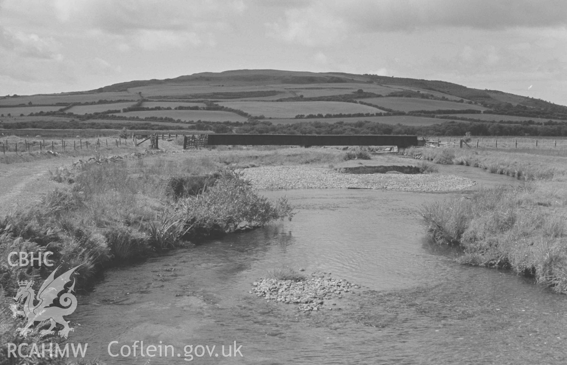 Digital copy of a black and white negative showing the railway bridge across the Teifi from by Dol-Beudiau farm. Photographed by Arthur Chater on 18 August 1968. Looking west from Grid Reference SN 710 663.