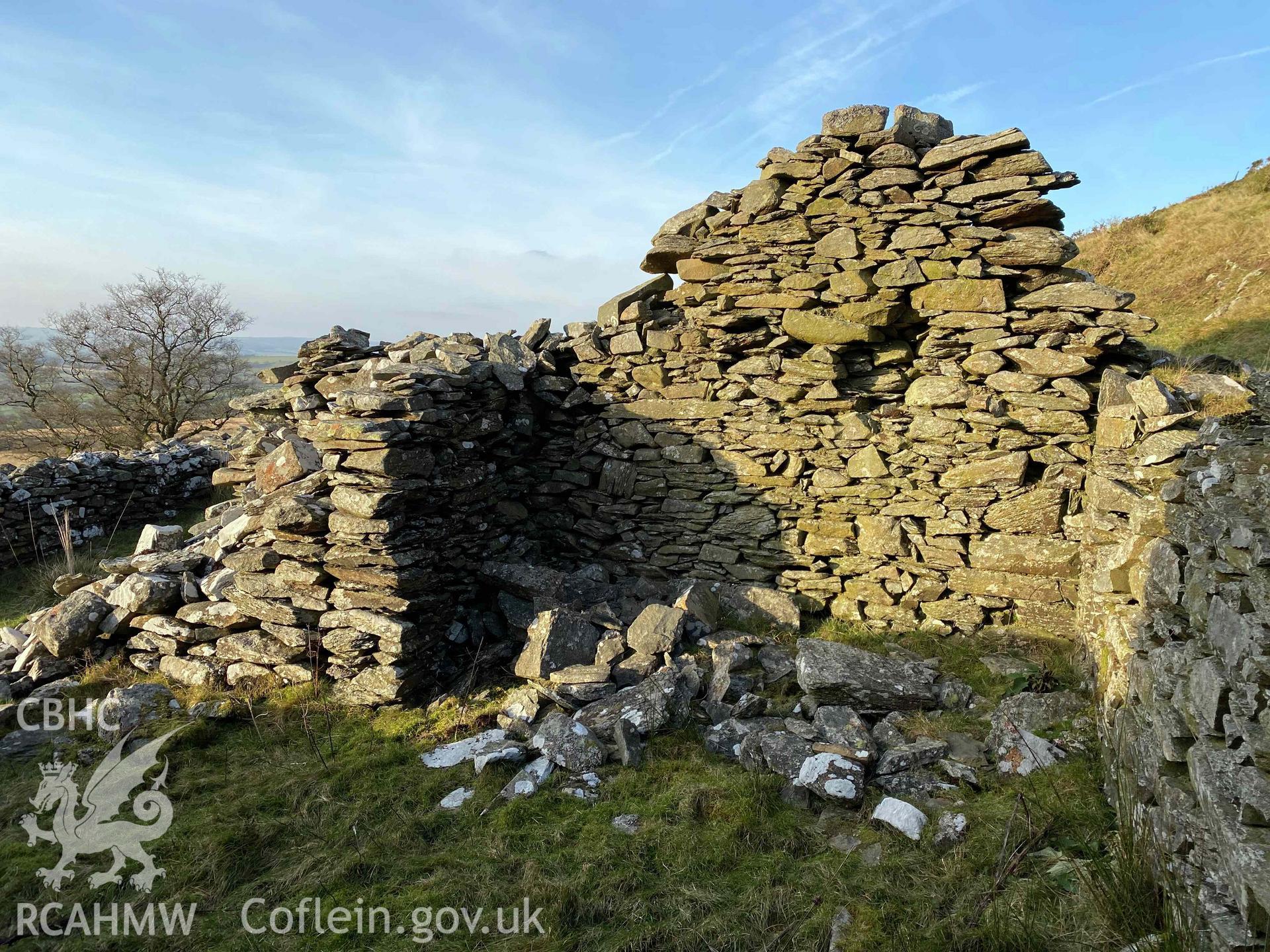 Digital colour photograph showing Ochr Bryn-lloi (view of fireplace).