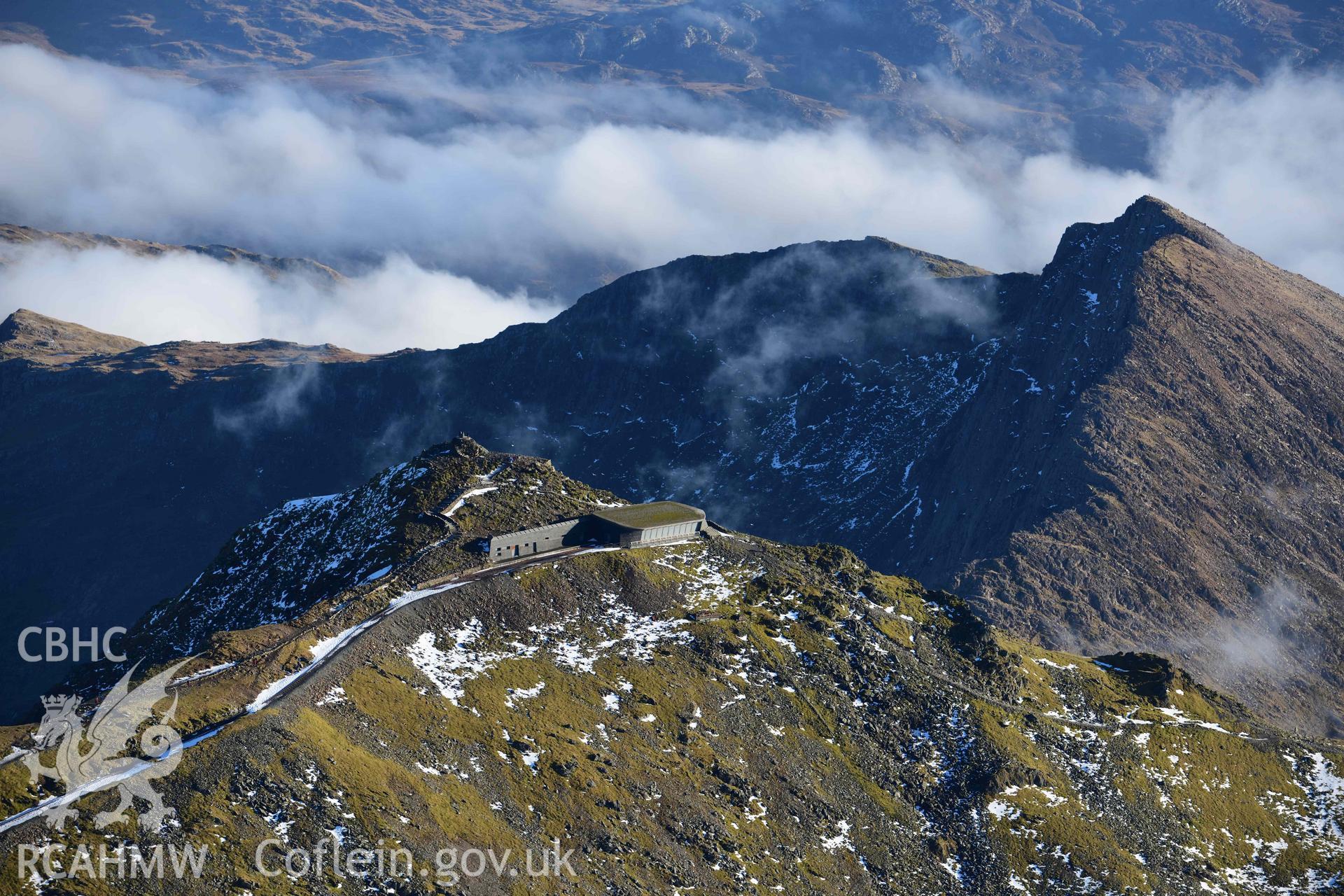 Oblique aerial photograph showing view from the north west towards Snowdon summit and railway, taken during the Royal Commission’s programme of archaeological aerial reconnaissance by Toby Driver on 12th January 2022