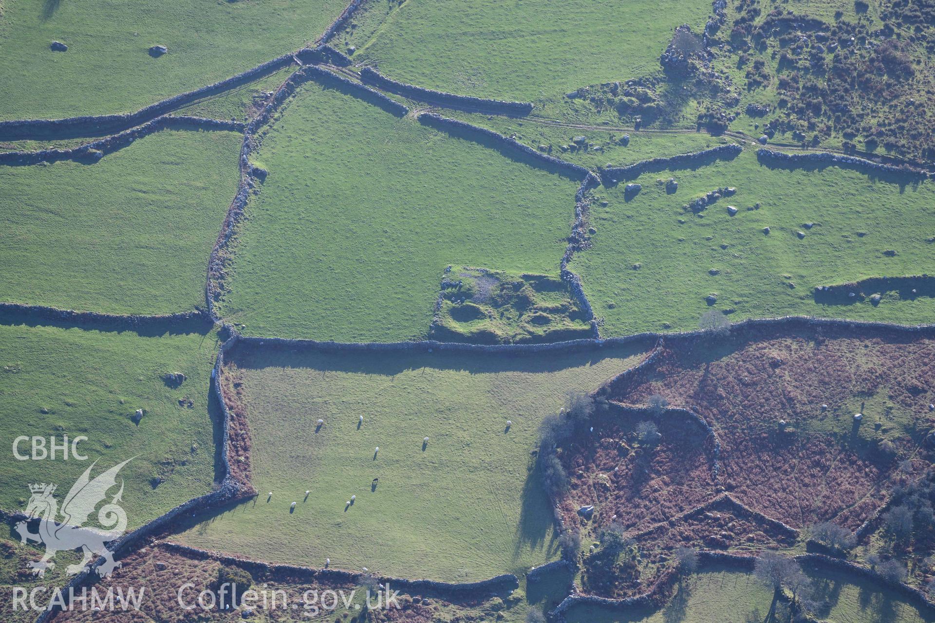 Oblique aerial photograph of Hafoty Ty-Newydd enclosed hut group, taken during the Royal Commission