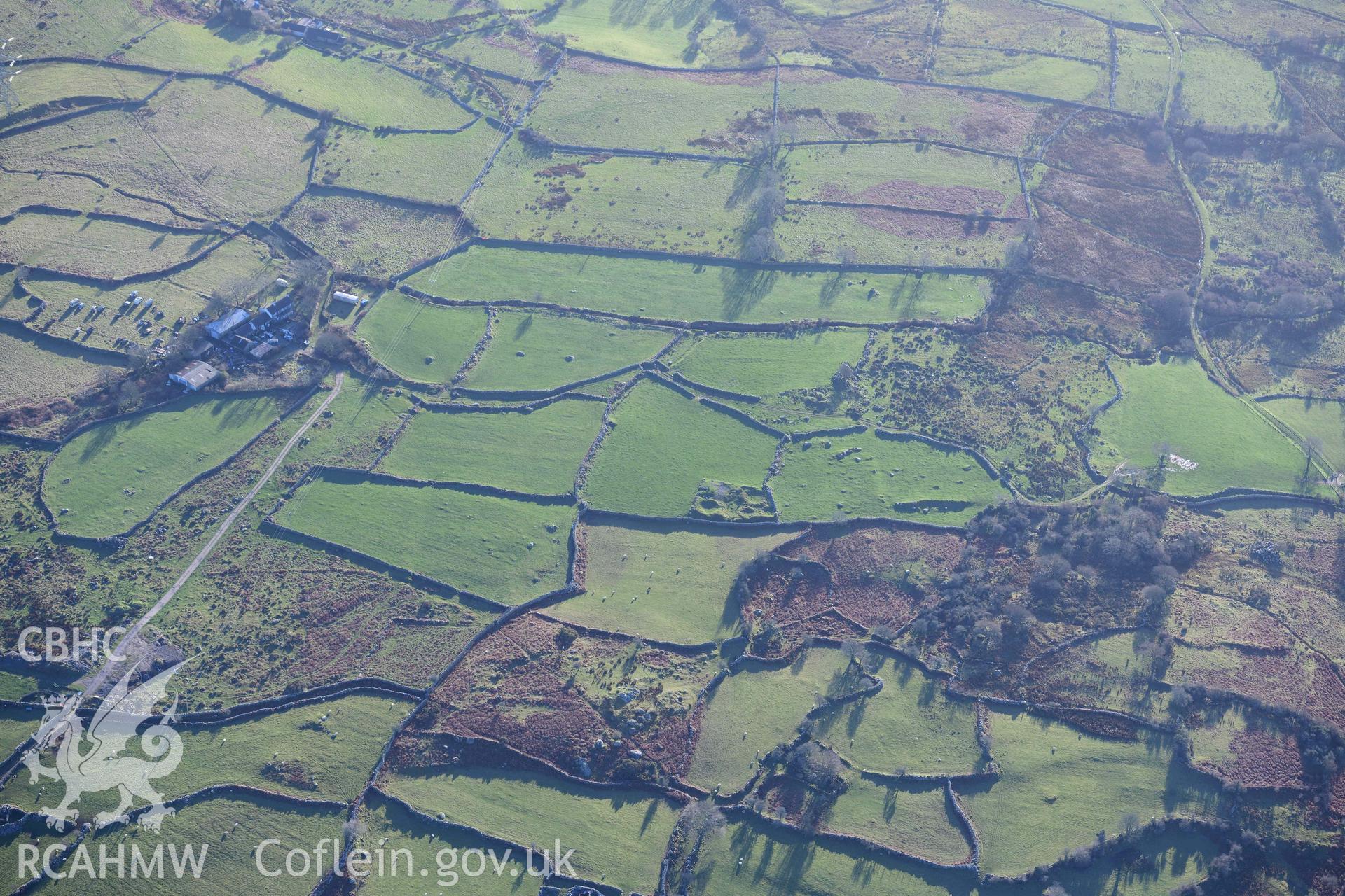 Oblique aerial photograph of Hafoty Ty-Newydd enclosed hut group, taken during the Royal Commission