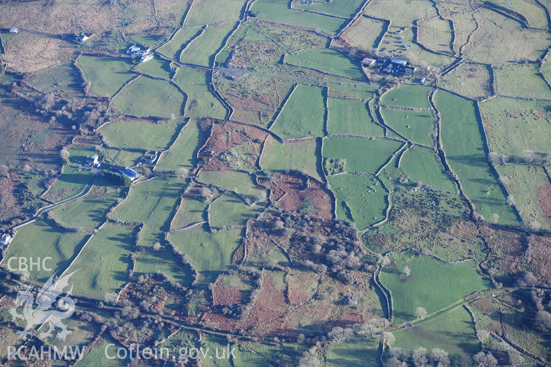 Oblique aerial photograph of Hafoty Ty-Newydd enclosed hut group, taken from the north west during the Royal Commission