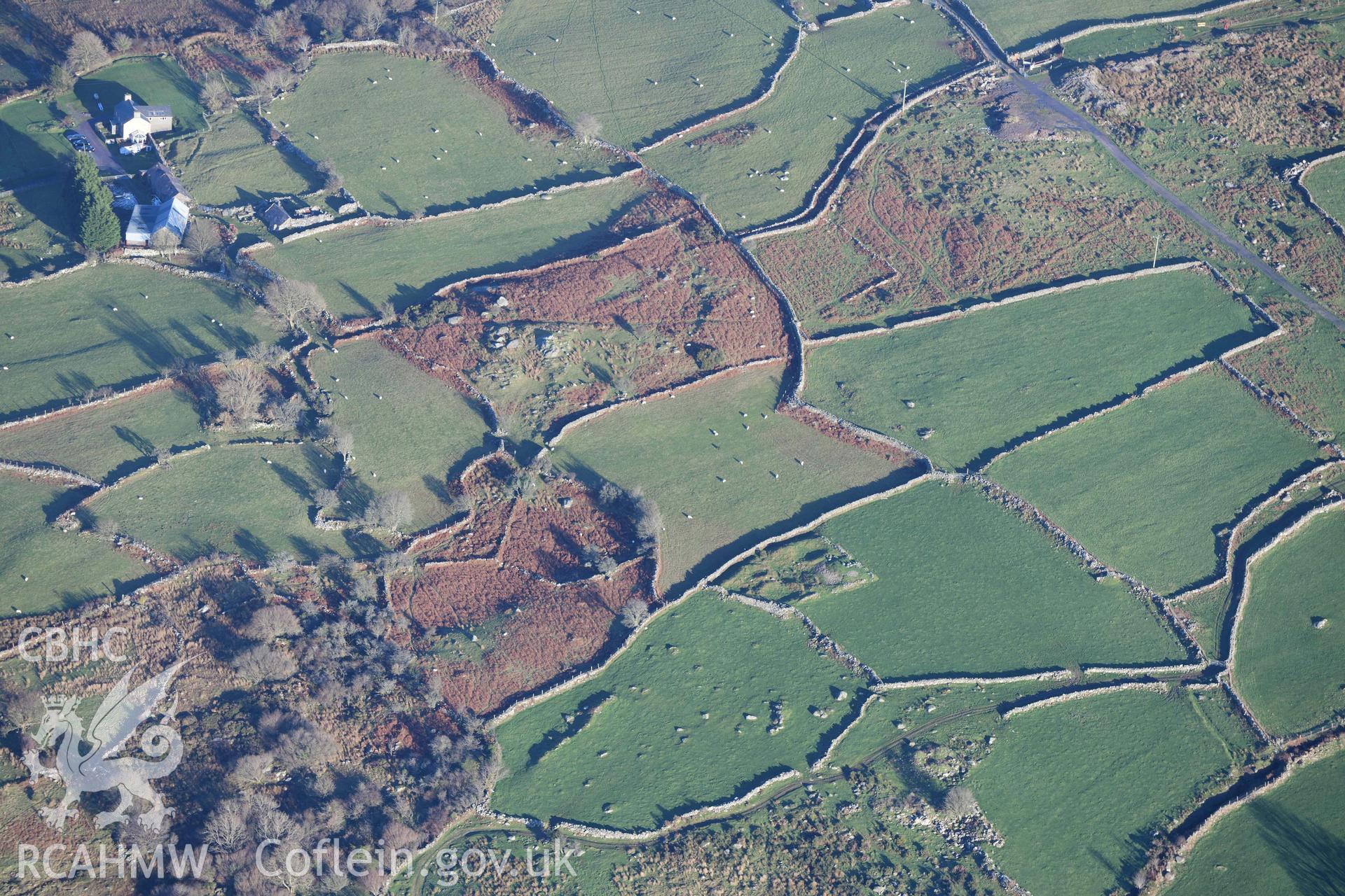 Oblique aerial photograph of Hafoty Ty-Newydd enclosed hut group, taken during the Royal Commission