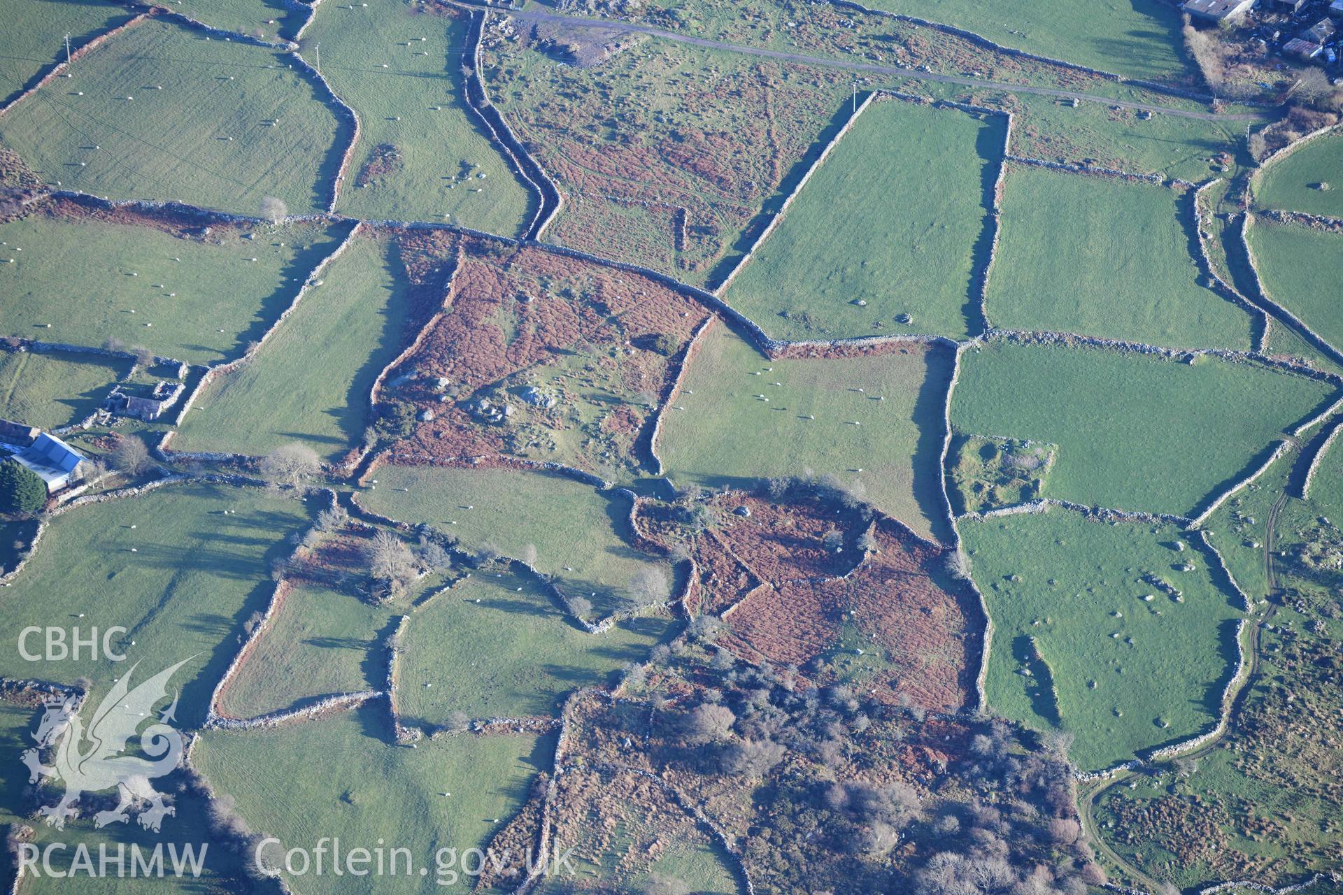 Oblique aerial photograph of Hafoty Ty-Newydd enclosed hut group, taken from the north west during the Royal Commission