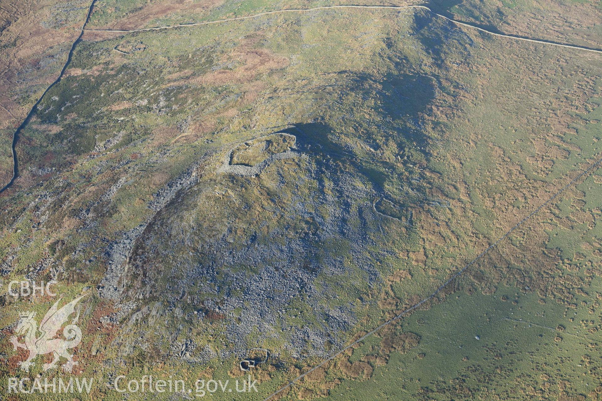 Oblique aerial photograph of Craig y Dinas hillfort and landscape, taken during the Royal Commission