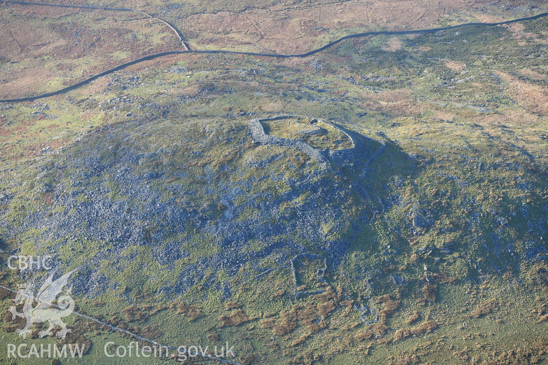 Oblique aerial photograph of Craig y Dinas hillfort and landscape, taken during the Royal Commission