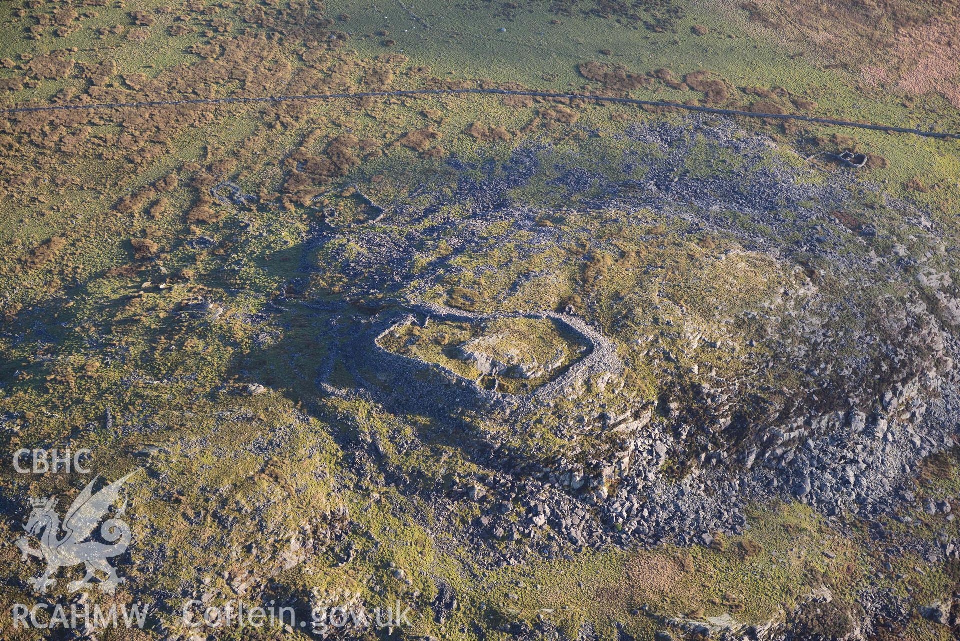 Oblique aerial photograph of Craig y Dinas hillfort and landscape, taken during the Royal Commission