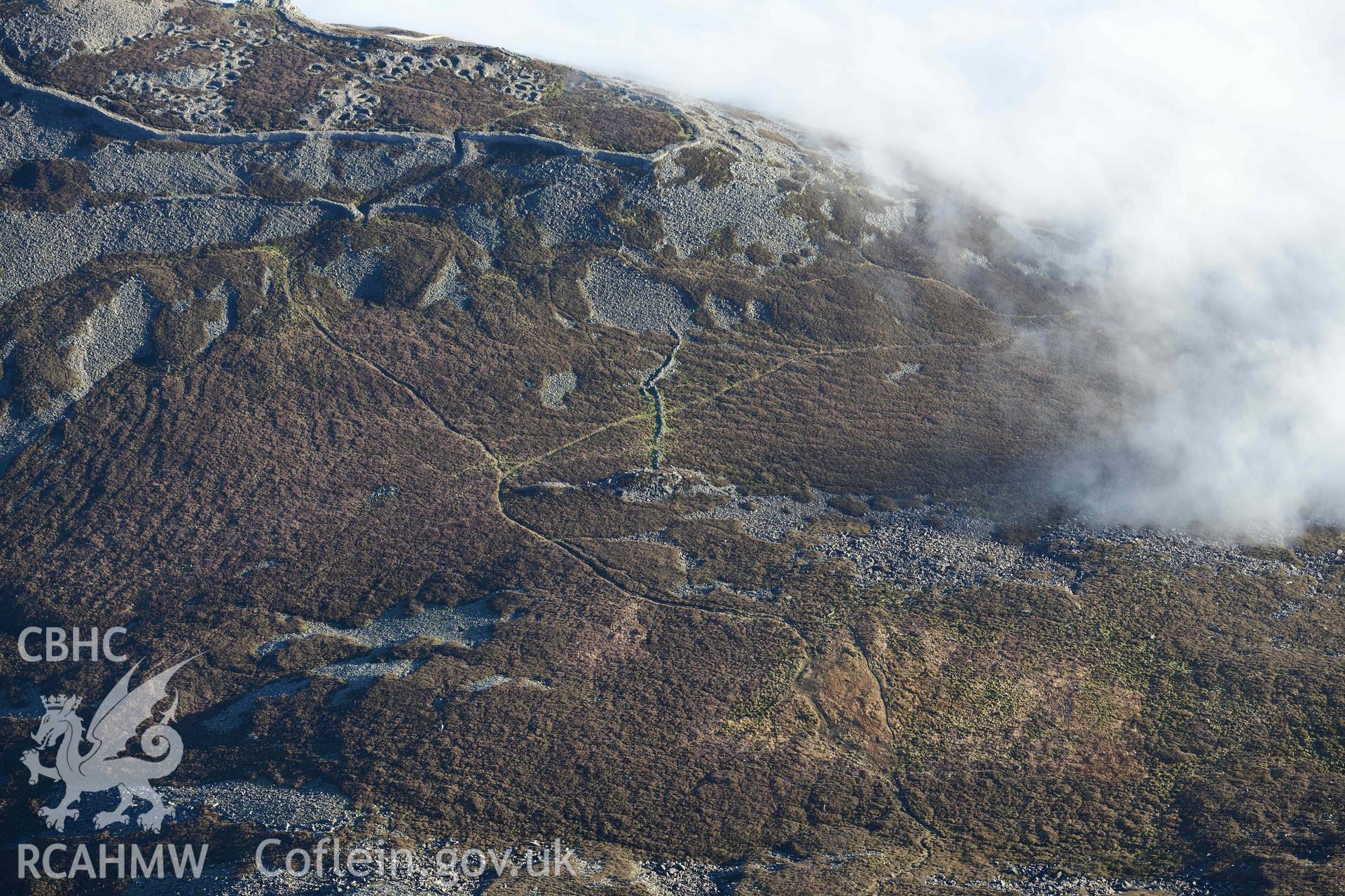 Oblique aerial photograph of Tre'r Ceiri, view from NW with col below hillfort, taken during the Royal Commission