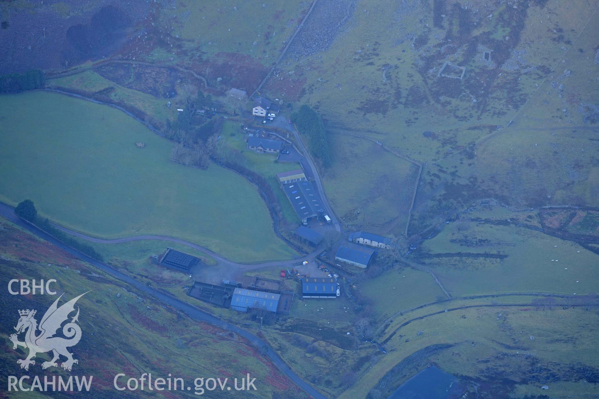 Oblique aerial photograph of Drws y Coed prehistoric settlement taken during the Royal Commission