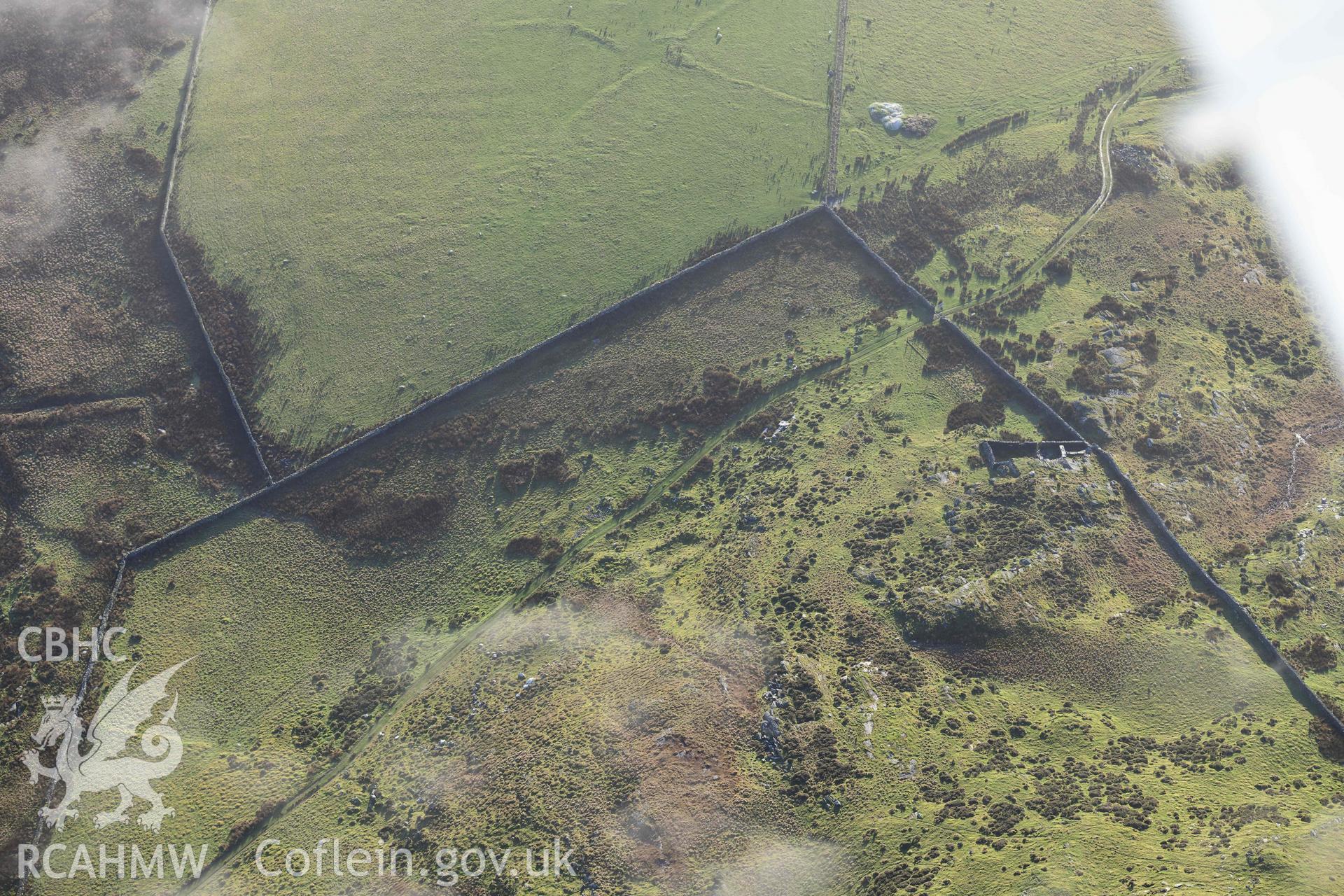 Oblique aerial photograph of Moel Goedog enclosed settlement taken during the Royal Commission