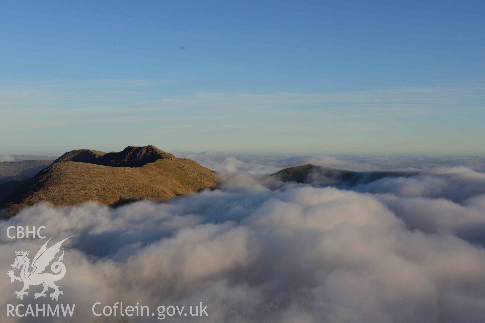 Oblique aerial photograph of Cader Idris, summit rising above cloud inversion, view from SW. Taken during the Royal Commission