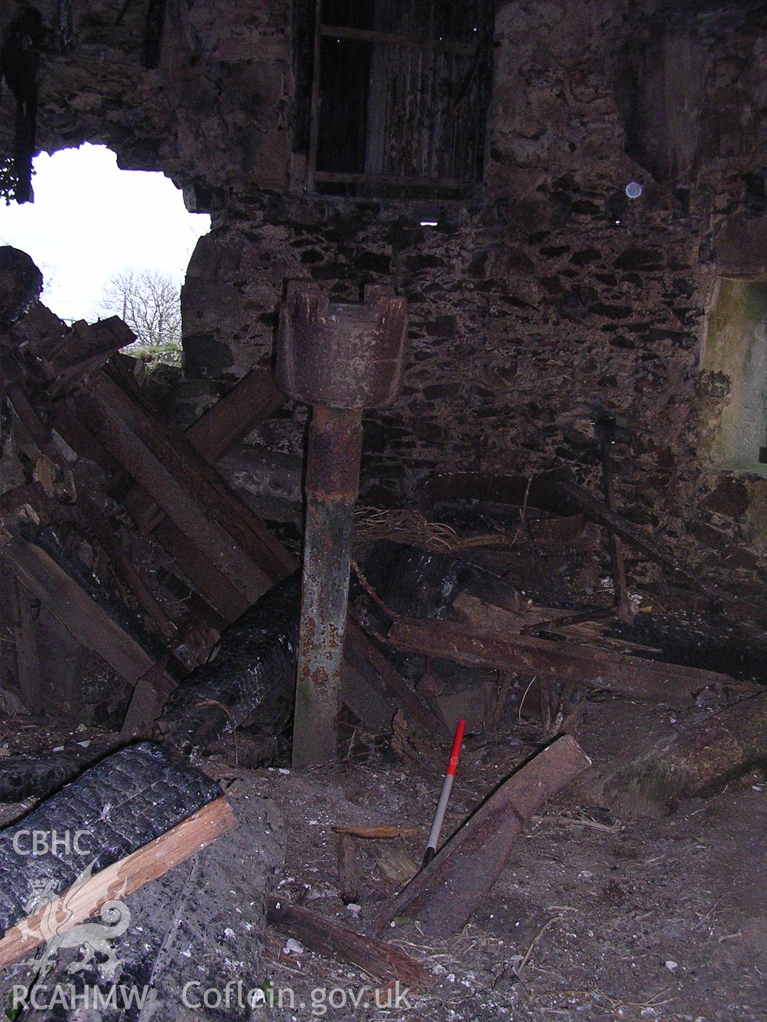 Digital photograph of assorted, disused mill machinery.