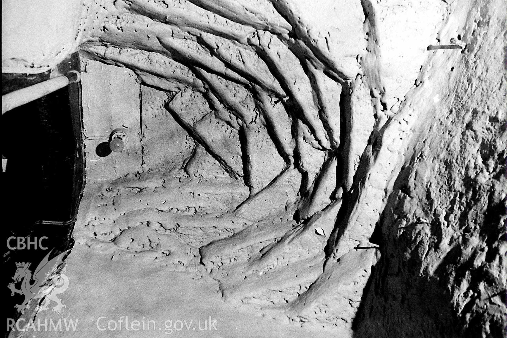 Digitised black and white photograph showing detail of corbelling over stair at Tyntyle. Produced by Paul Davis in 1984