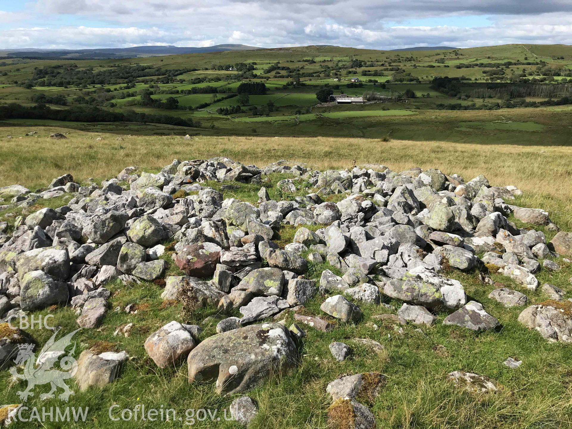 Digital photograph showing detailed view of cairn with kerb at Pant Sychbant. Produced by Paul Davis in 2020