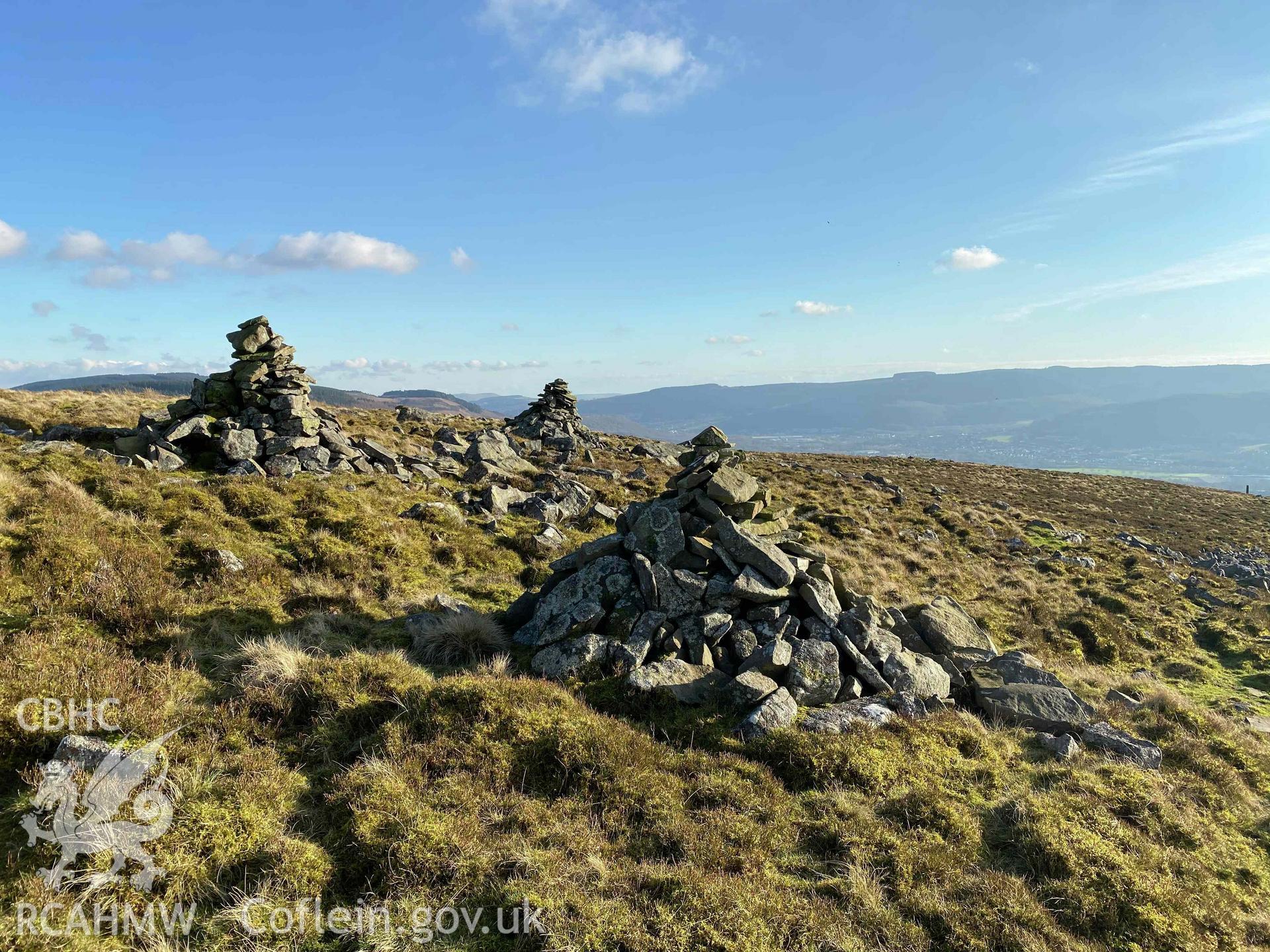 Digital photograph showing piles of stones at Buarth Maen settlement remains, produced by Paul Davis in 2020