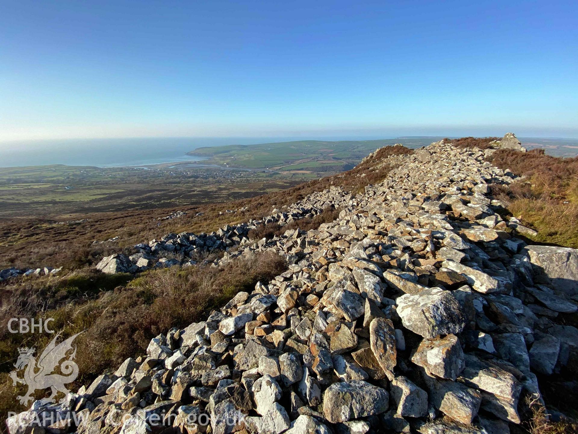 Digital photograph showing general view of drystone wall and landscape at Carn Ingli camp, produced by Paul Davis in 2020