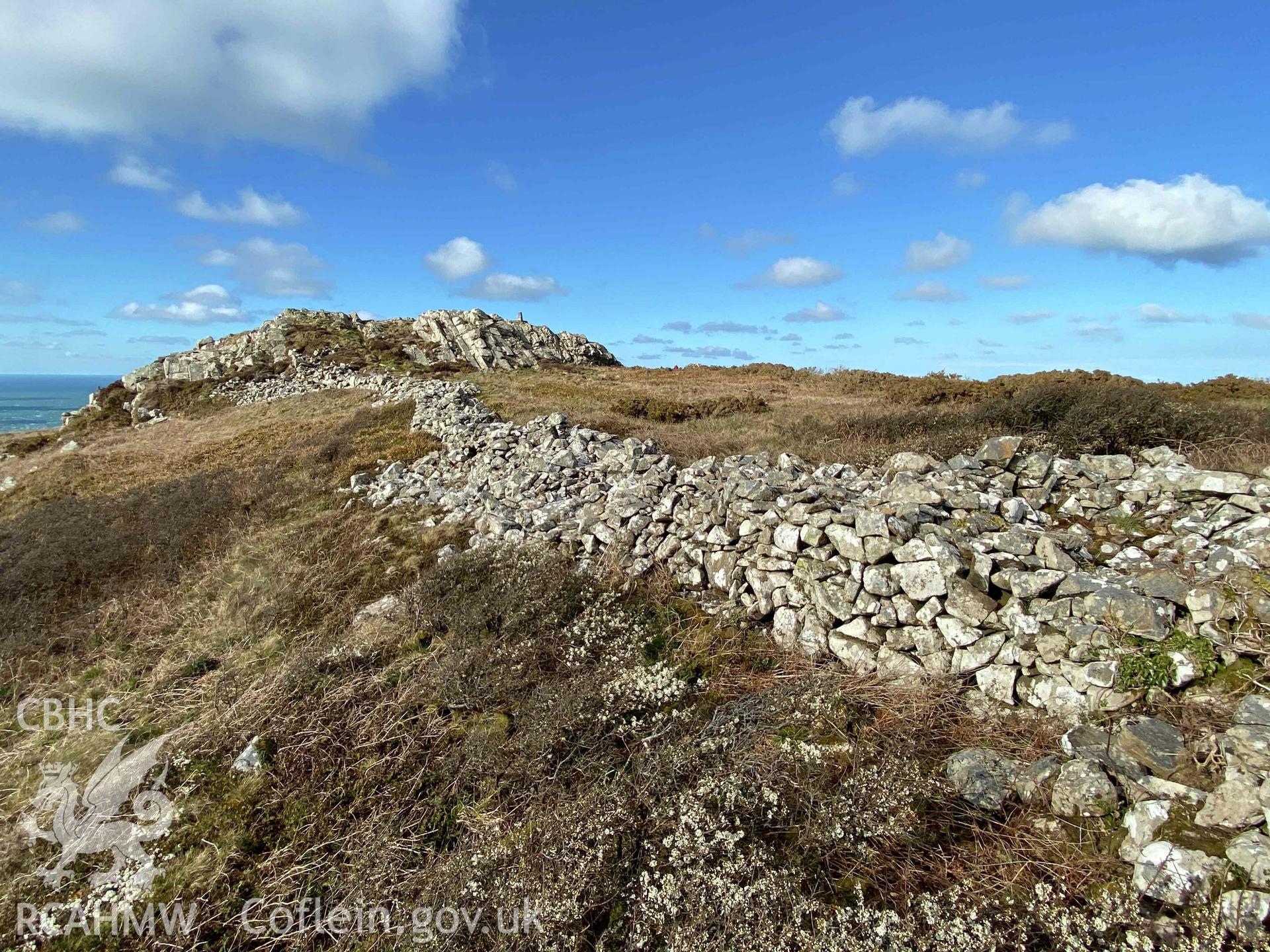 Digital photograph showing general view of stony banks and rampart at Garn Fawr camp, produced by Paul Davis in 2020