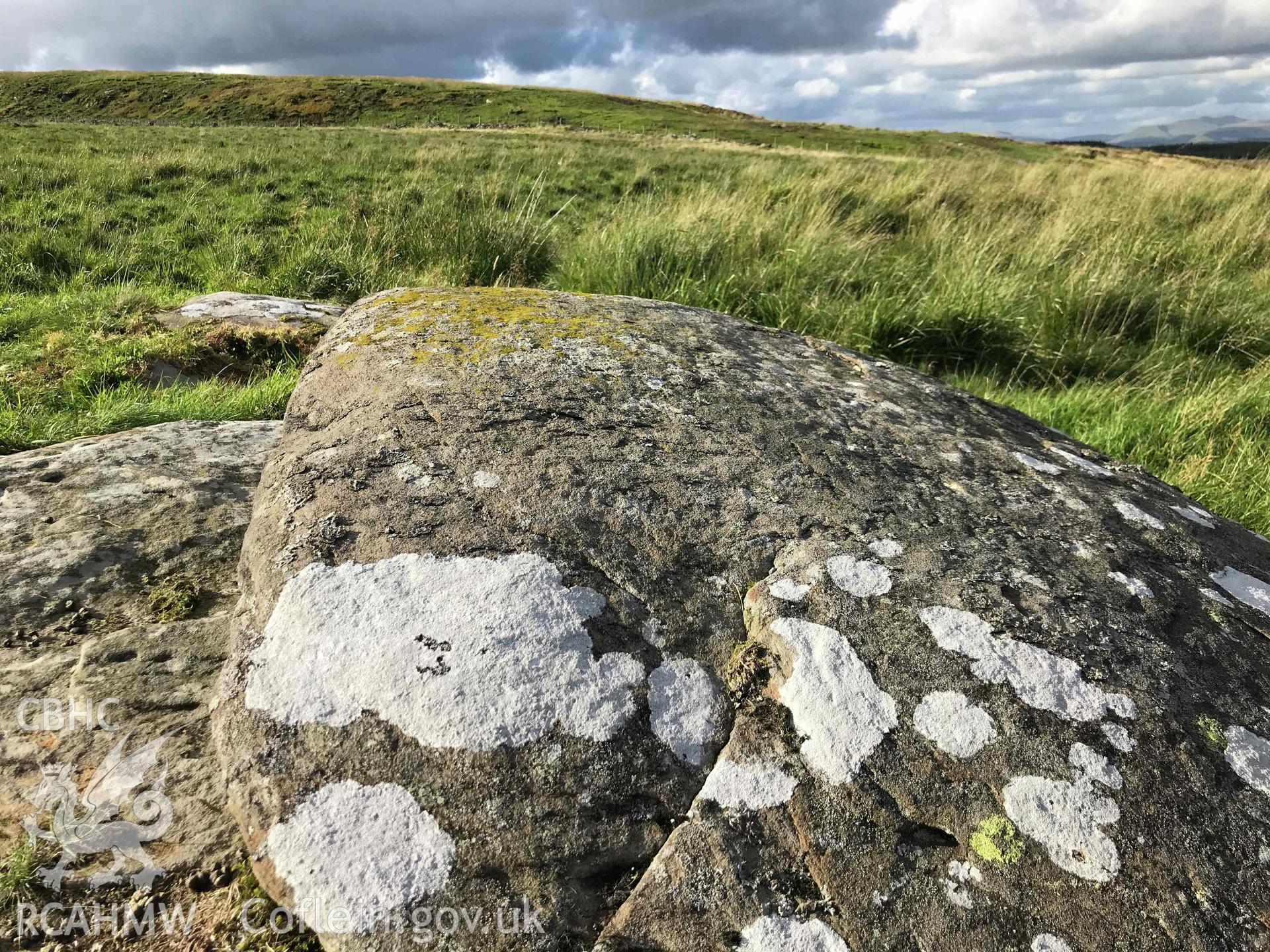 Digital photograph showing detailed view of logan stone near Tarren Maerdy cairn, produced by Paul Davis in 2020