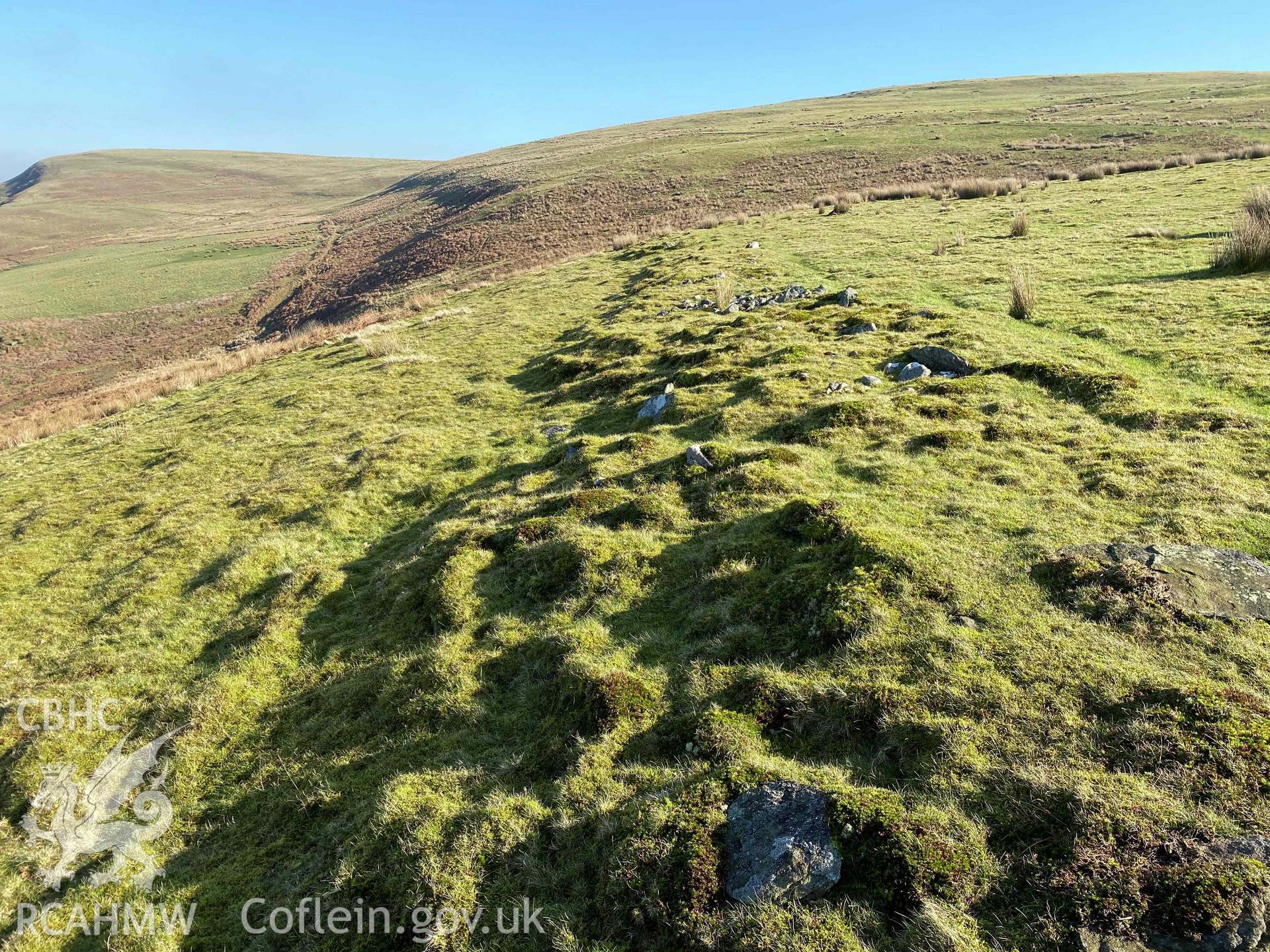 Digital photographs of linear wall at Dinas Noddfa platform settlement, produced by Paul Davis in 2020