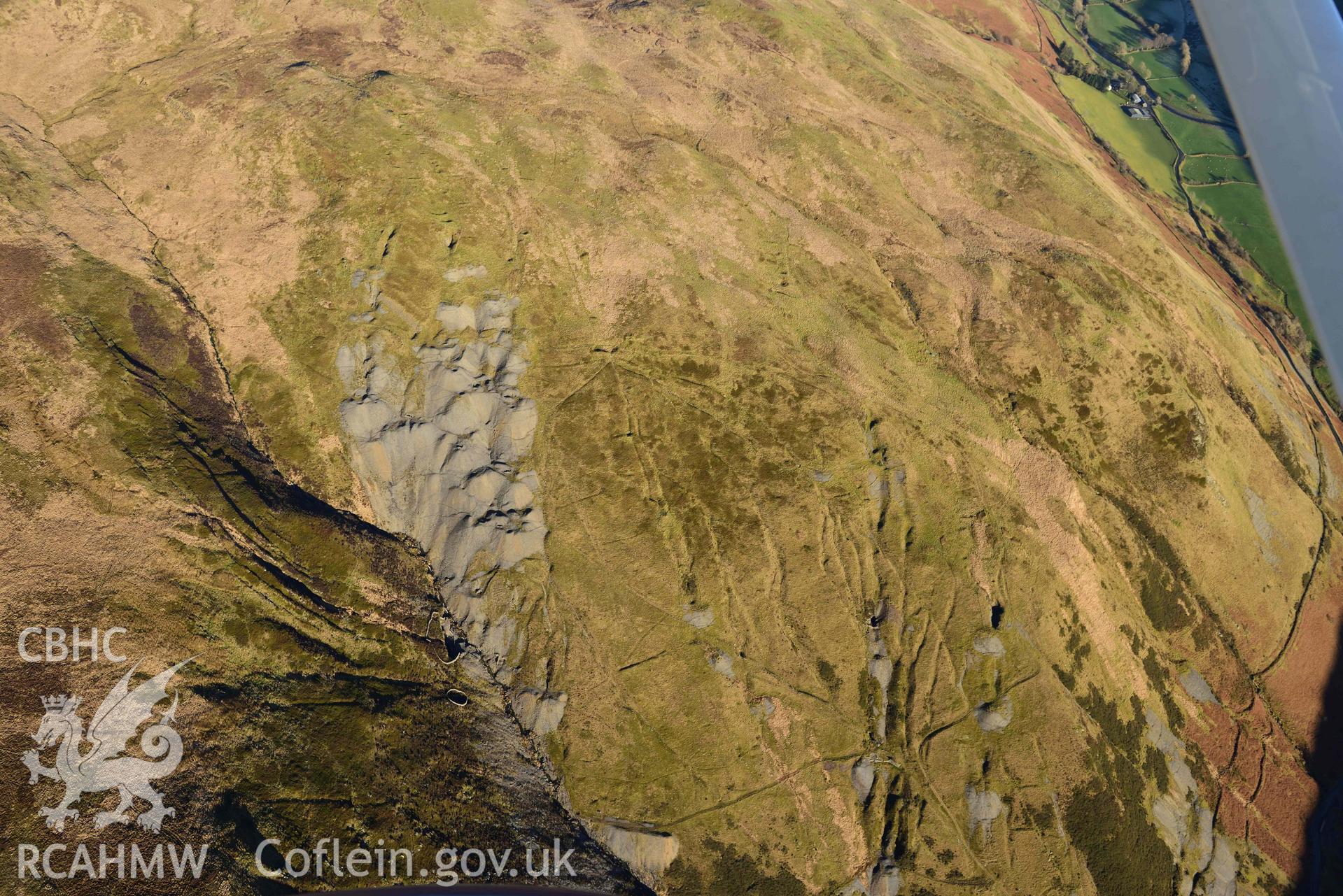 Oblique aerial photograph of Copa Hill taken during the Royal Commission’s programme of archaeological aerial reconnaissance by Toby Driver on 17th January 2022