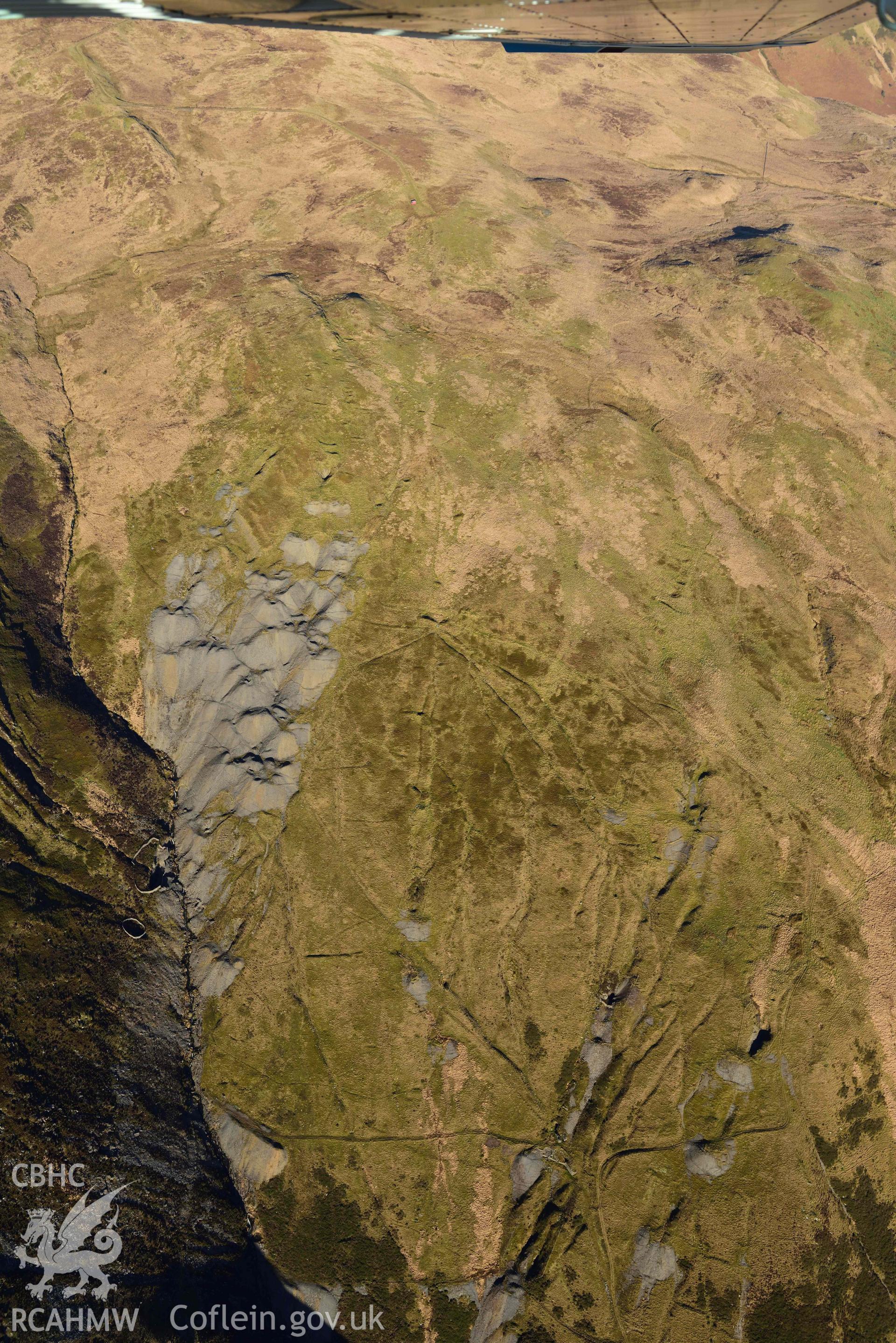 Oblique aerial photograph of Copa Hill taken during the Royal Commission’s programme of archaeological aerial reconnaissance by Toby Driver on 17th January 2022