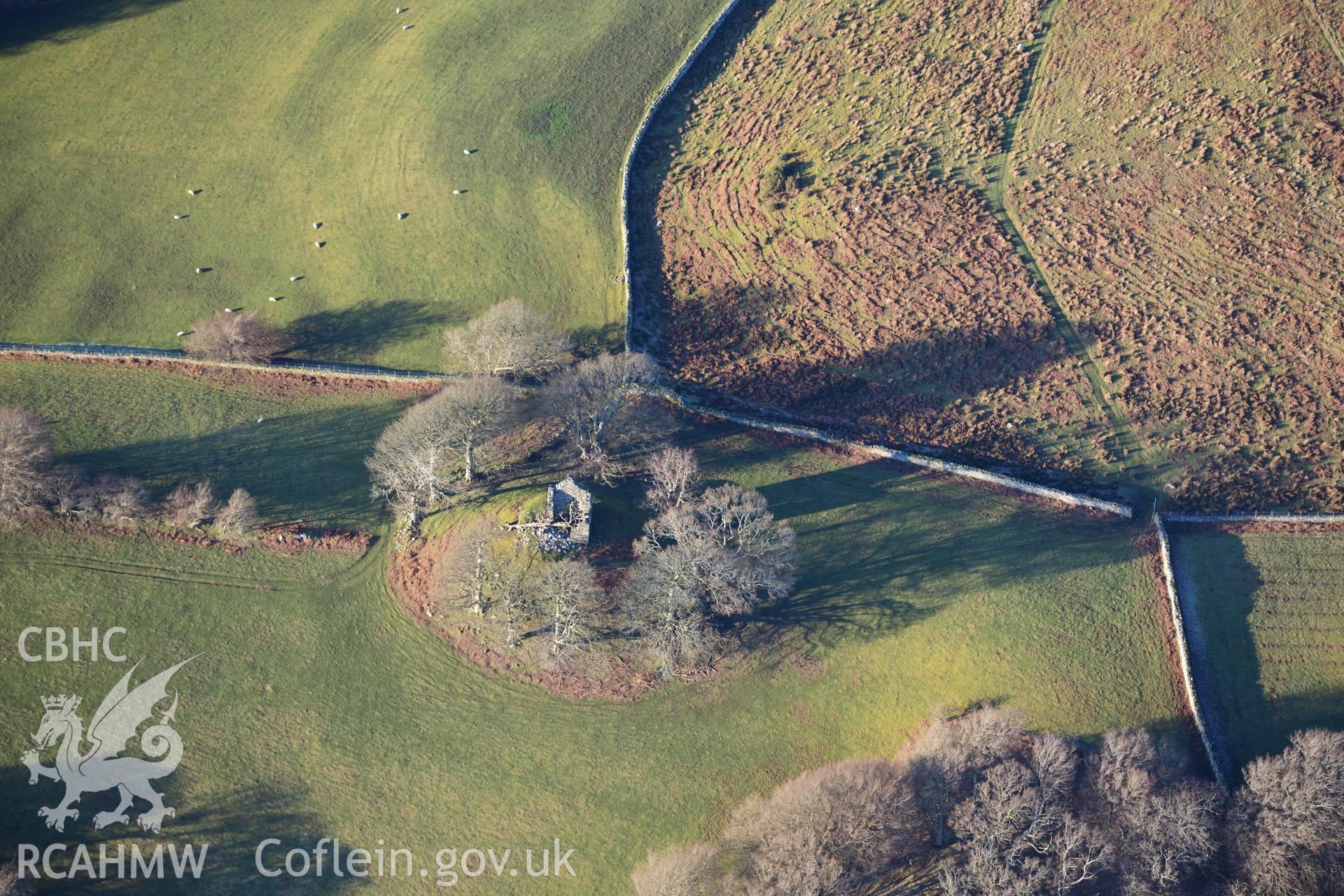 Oblique aerial photograph showing land to the immediate north of Cymmer Castle mound. Taken during the Royal Commission’s programme of archaeological aerial reconnaissance by Toby Driver on 17th January 2022