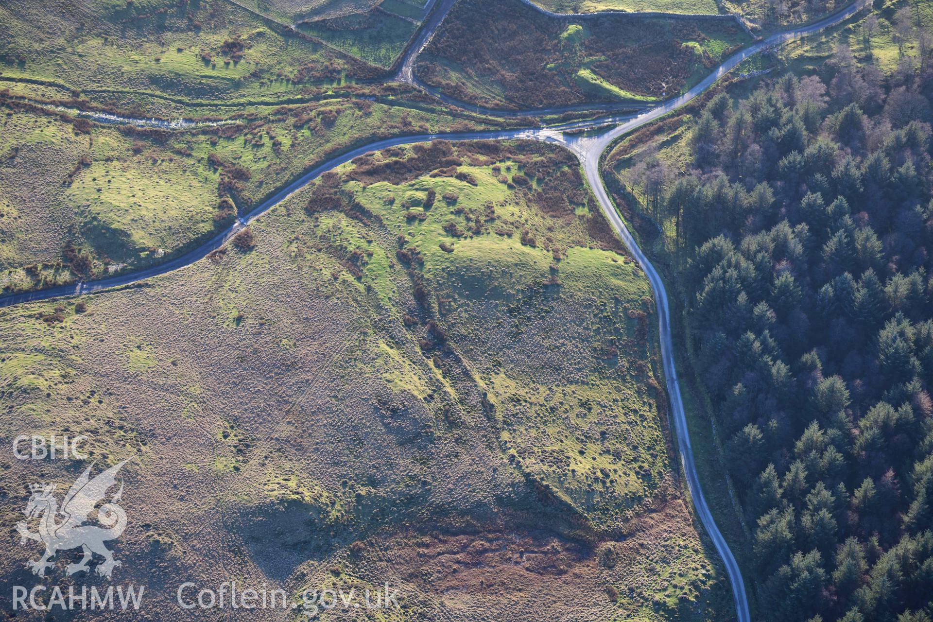 Oblique aerial photograph of Tomen y Mur barrow cemetery and amphitheatre taken during the Royal Commission’s programme of archaeological aerial reconnaissance by Toby Driver on 17th January 2022