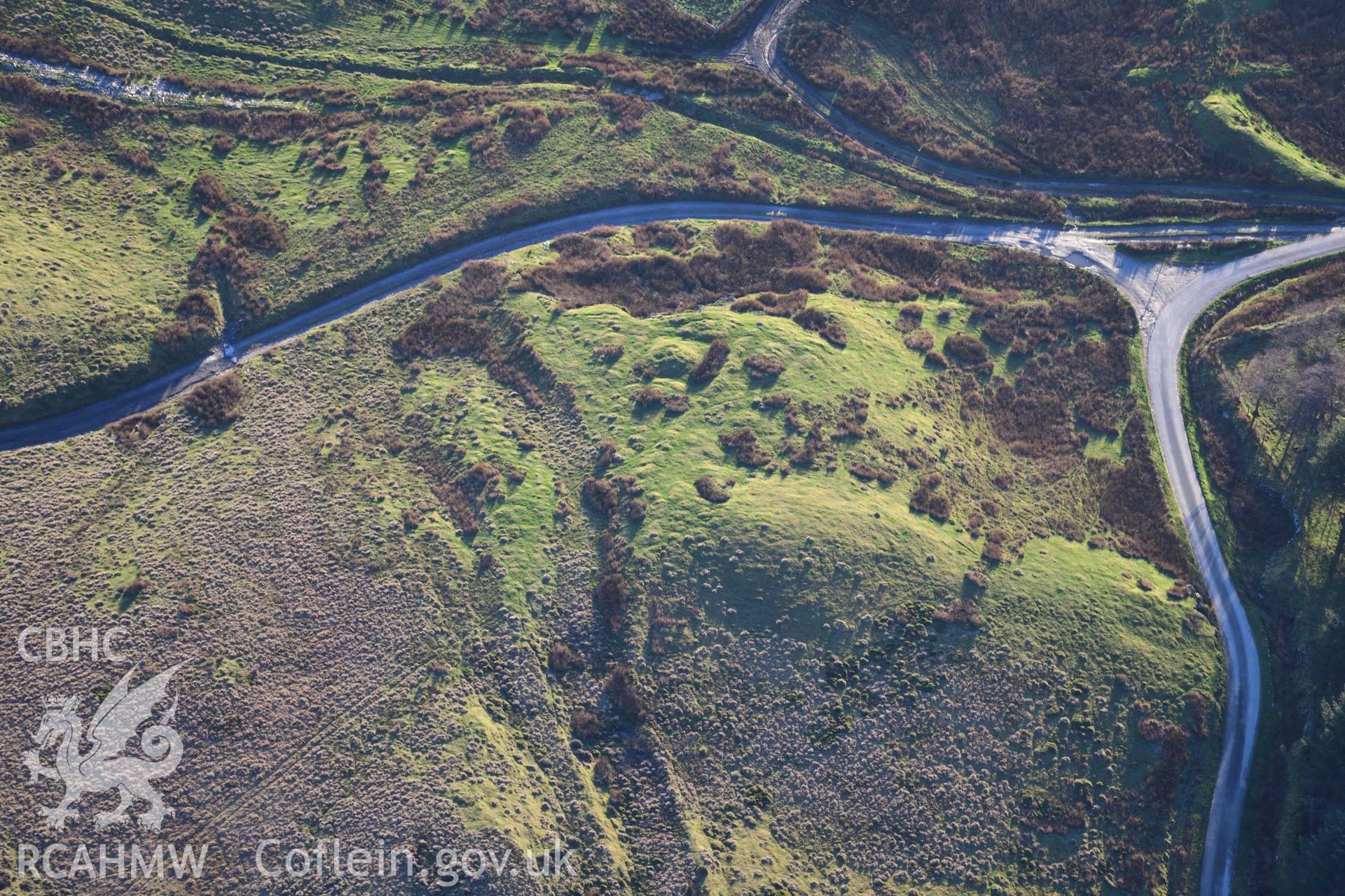 Oblique aerial photograph of Tomen y Mur barrow cemetery and amphitheatre taken during the Royal Commission’s programme of archaeological aerial reconnaissance by Toby Driver on 17th January 2022