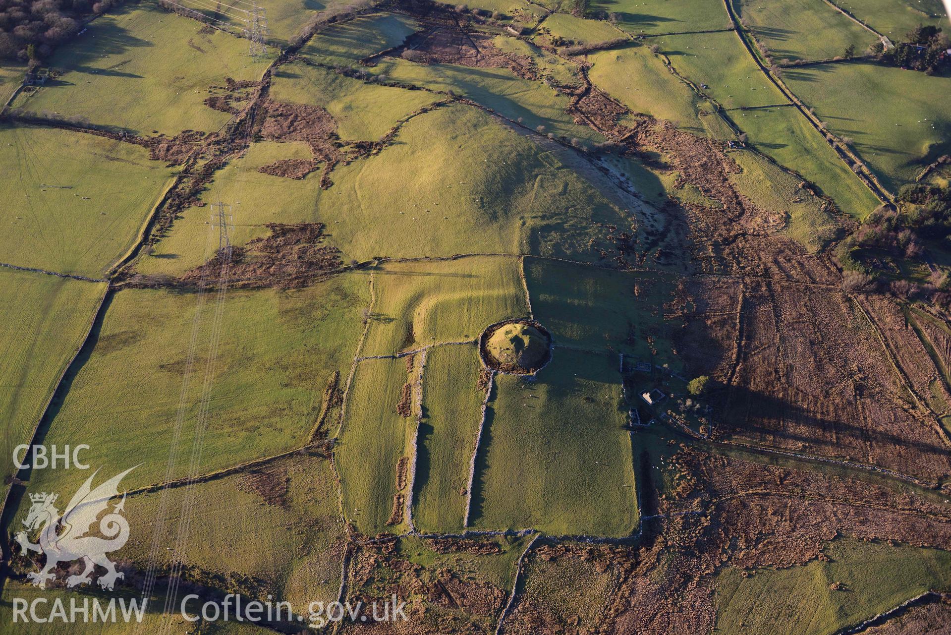 Oblique aerial photograph of Tomen y Mur Roman fort and earthwork complex. Taken during the Royal Commission’s programme of archaeological aerial reconnaissance by Toby Driver on 17th January 2022