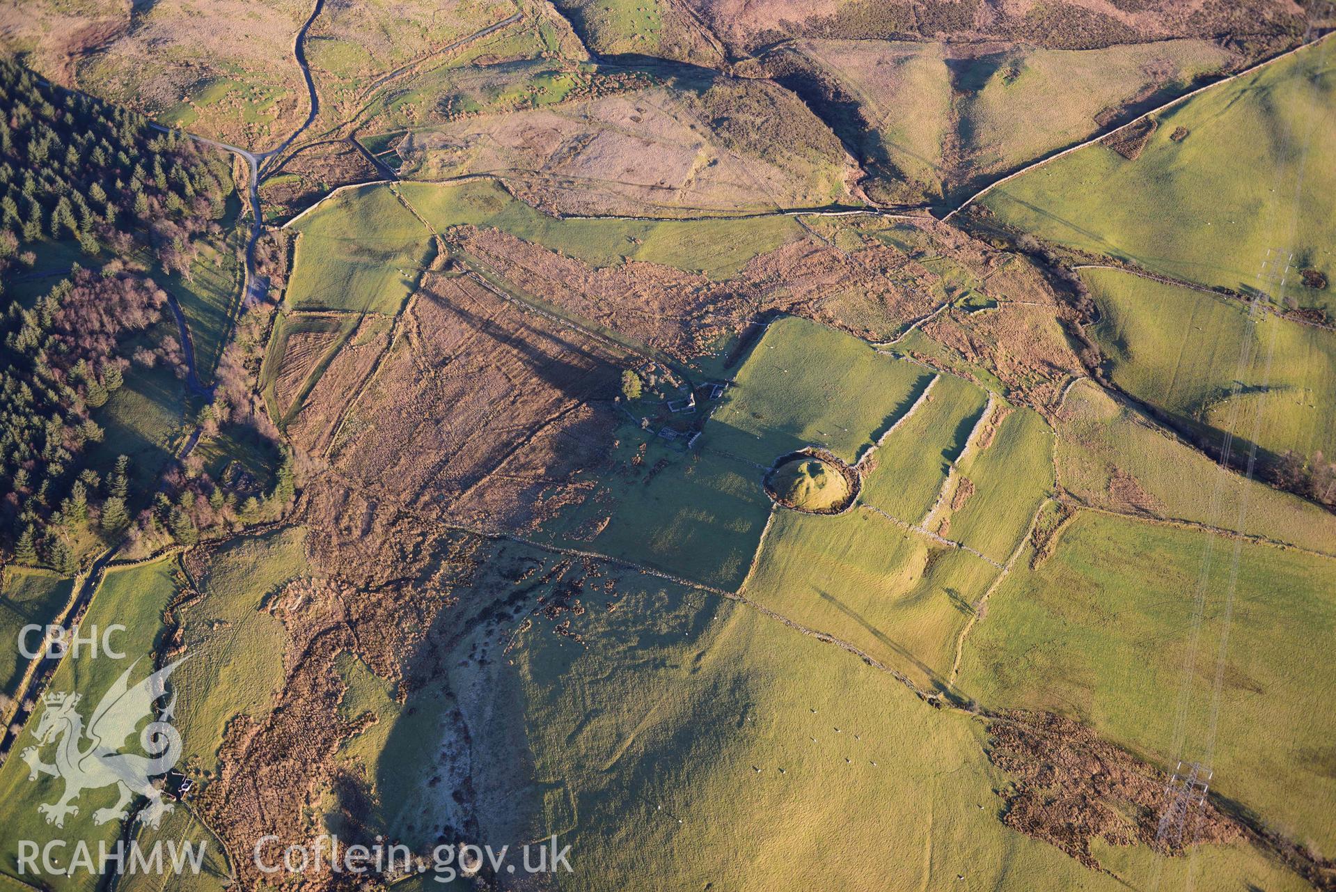 Oblique aerial photograph of Tomen y Mur Roman fort and earthwork complex. Taken during the Royal Commission’s programme of archaeological aerial reconnaissance by Toby Driver on 17th January 2022