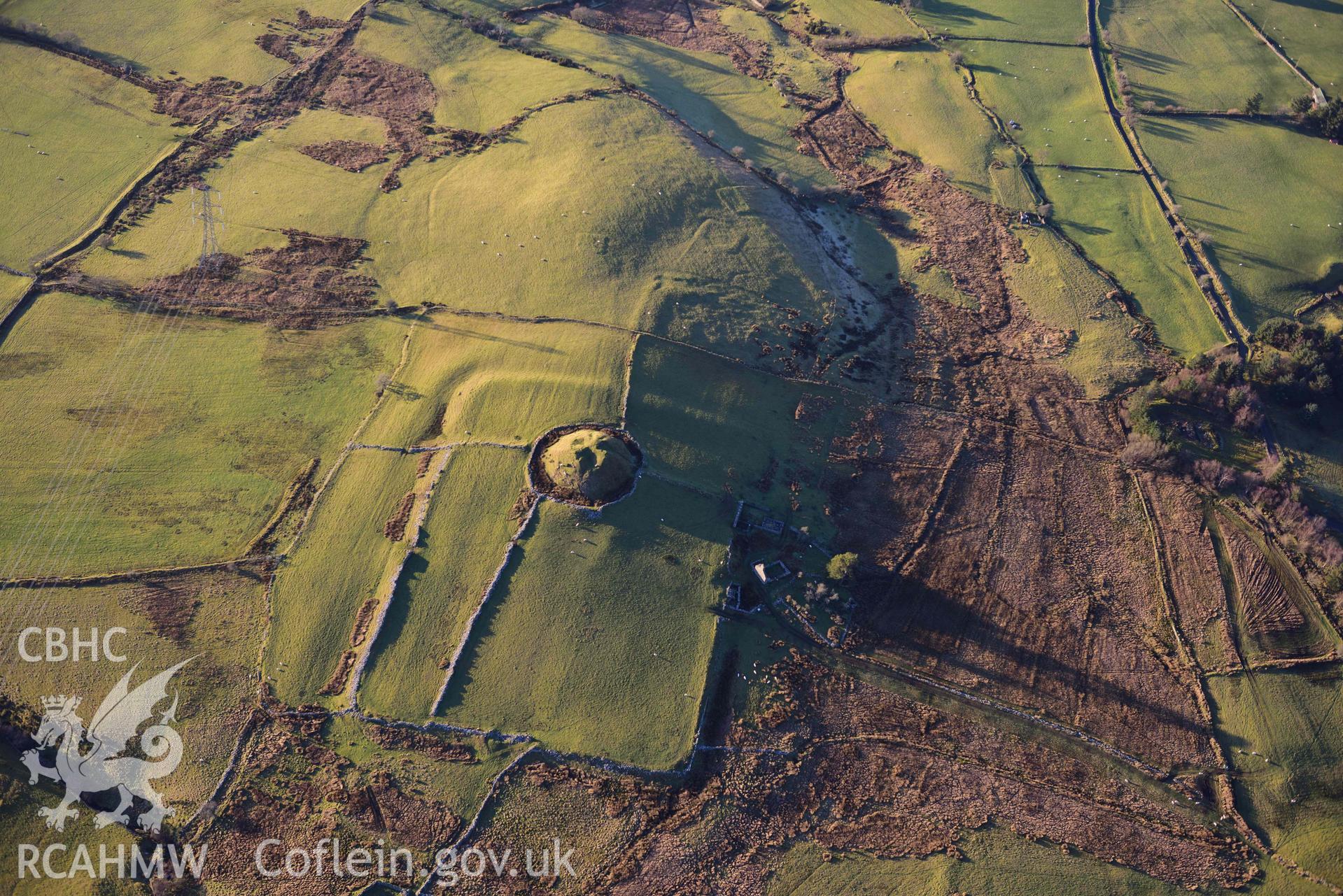 Oblique aerial photograph of Tomen y Mur Roman fort and earthwork complex. Taken during the Royal Commission’s programme of archaeological aerial reconnaissance by Toby Driver on 17th January 2022