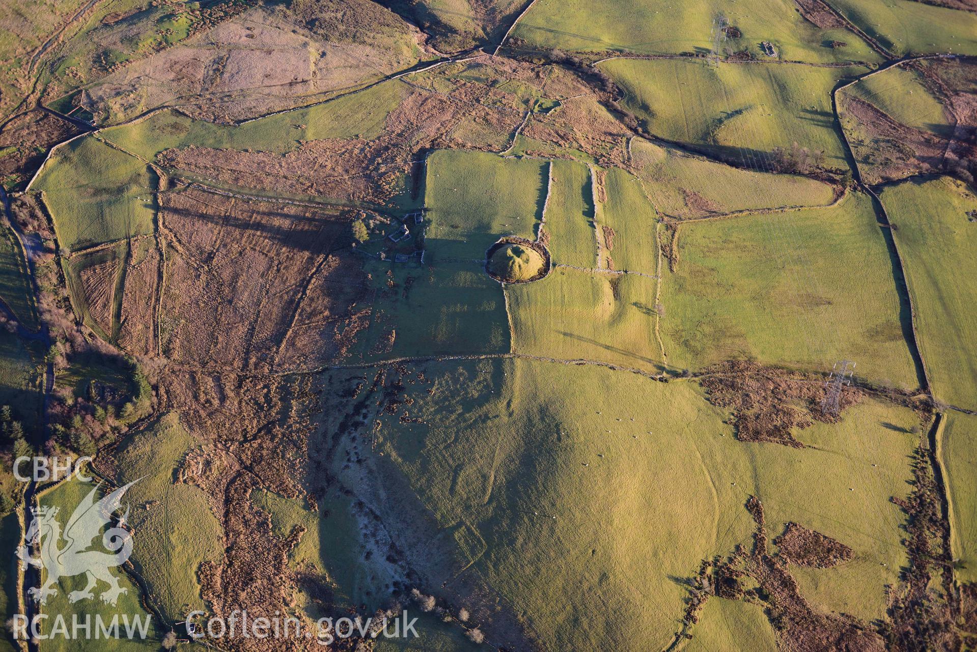 Oblique aerial photograph of Tomen y Mur Roman fort and earthwork complex. Taken during the Royal Commission’s programme of archaeological aerial reconnaissance by Toby Driver on 17th January 2022