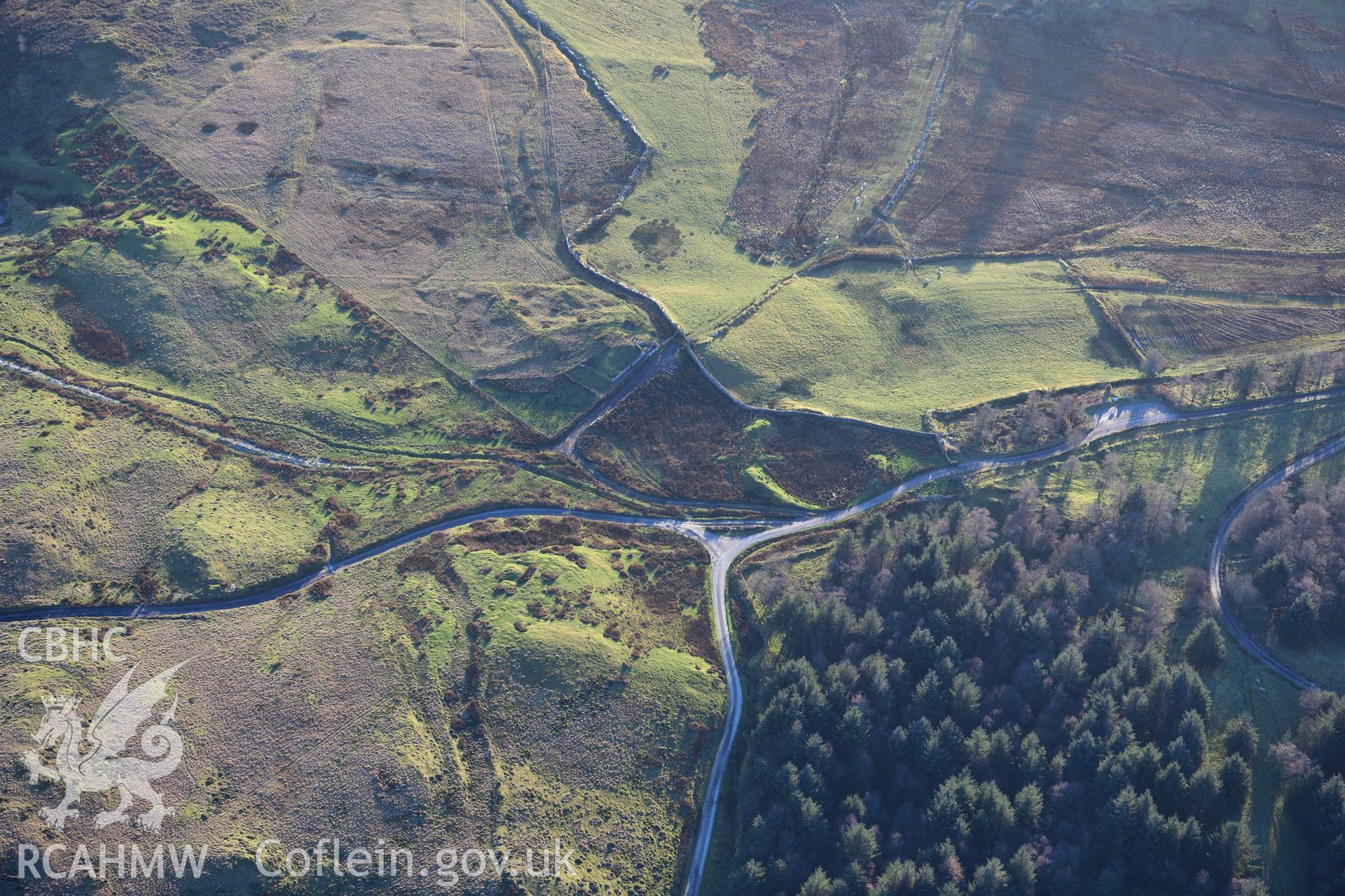 Oblique aerial photograph of Tomen y Mur amphitheatre taken during the Royal Commission’s programme of archaeological aerial reconnaissance by Toby Driver on 17th January 2022