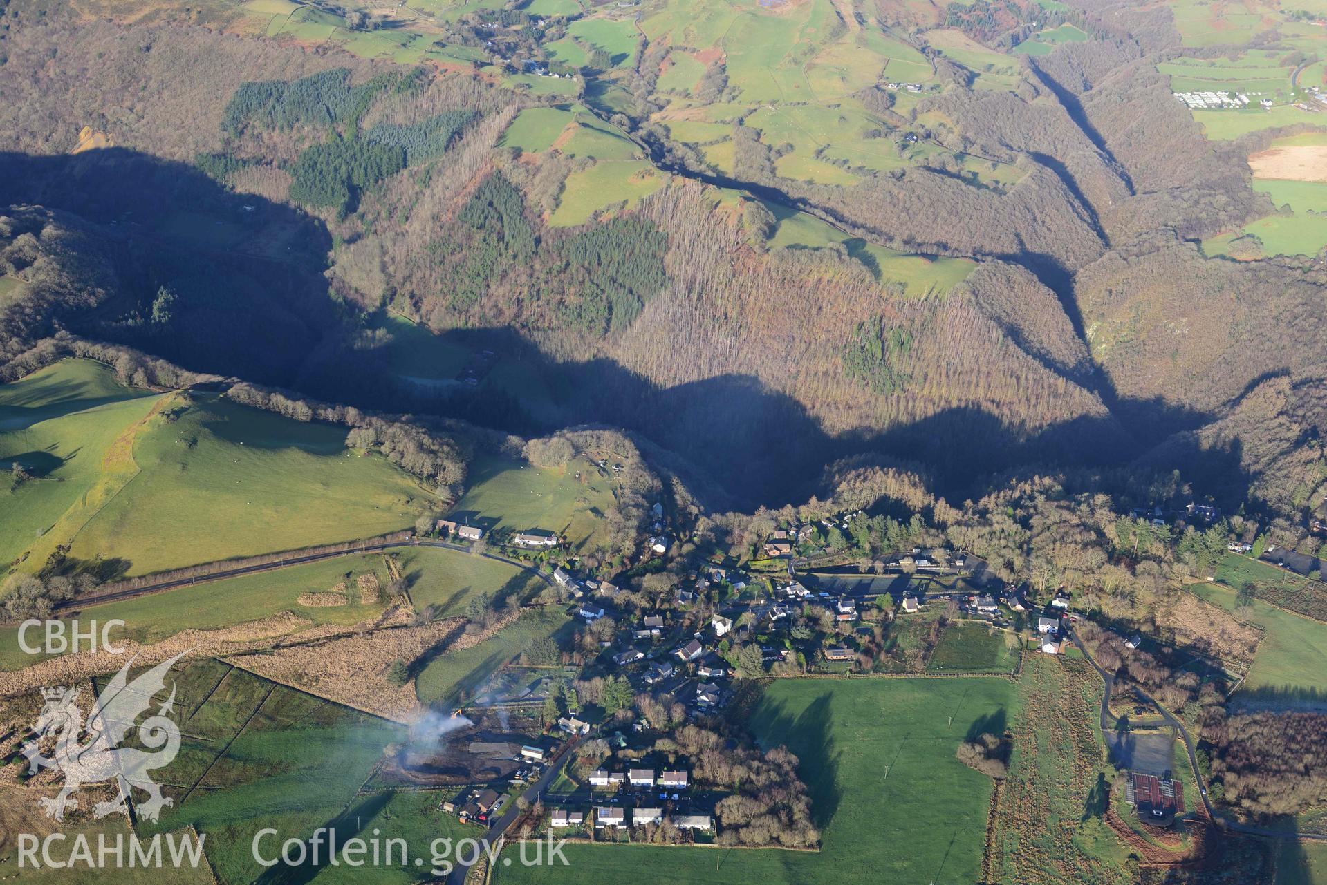 Oblique aerial photograph showing winter landscape of Devils Bridge with Rheidol gorge, from the south. Taken during the Royal Commission’s programme of archaeological aerial reconnaissance by Toby Driver on 17th January 2022