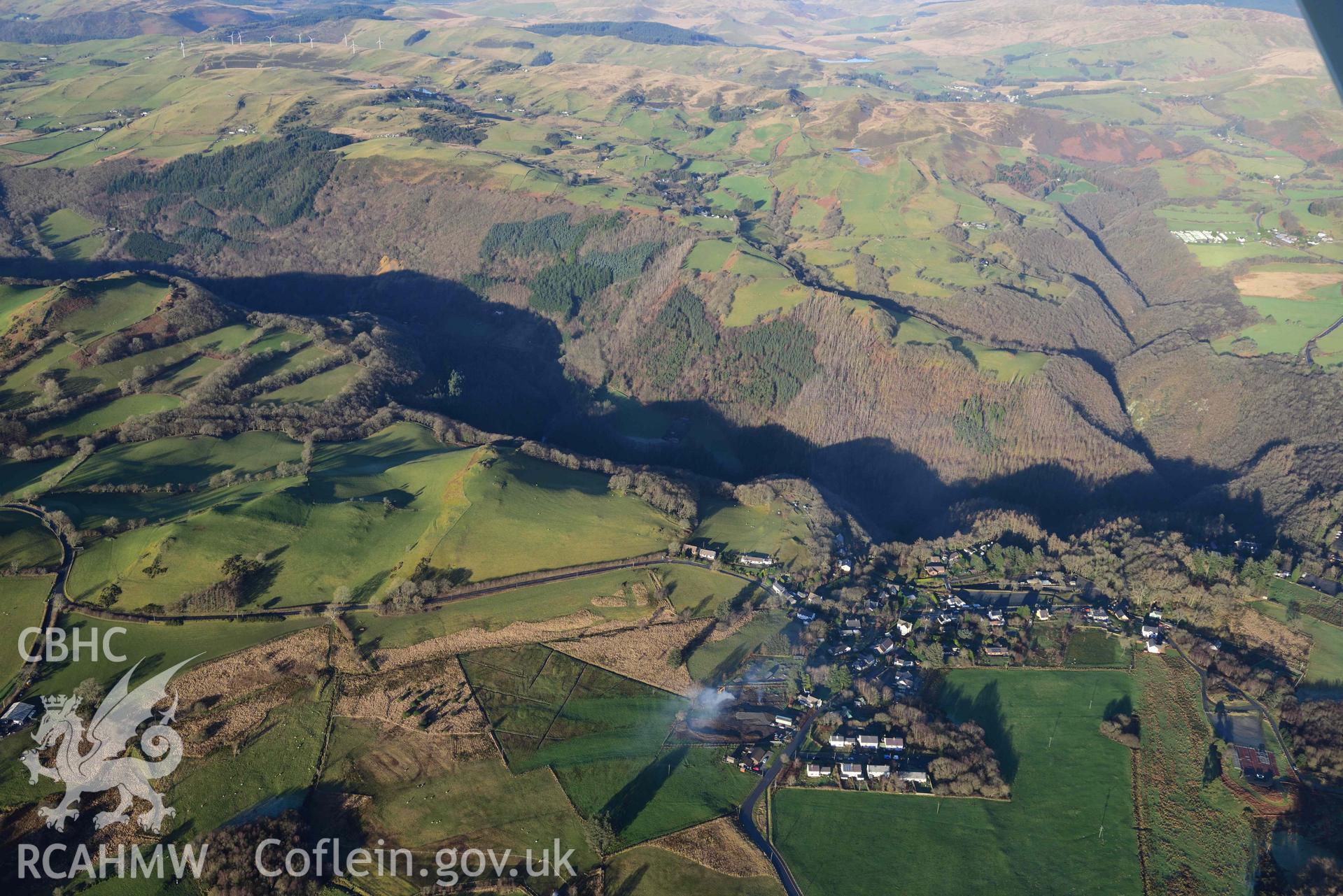 Oblique aerial photograph showing winter landscape of Devils Bridge with Rheidol gorge, from the south. Taken during the Royal Commission’s programme of archaeological aerial reconnaissance by Toby Driver on 17th January 2022