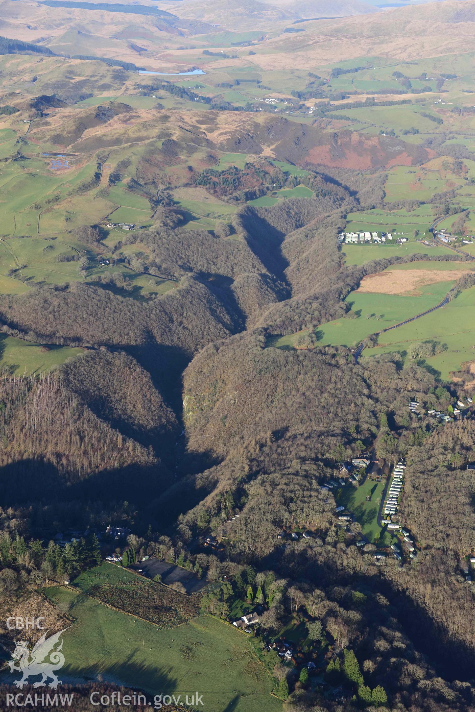 Oblique aerial photograph showing winter landscape of Devils Bridge with Rheidol gorge, from the south. Taken during the Royal Commission’s programme of archaeological aerial reconnaissance by Toby Driver on 17th January 2022