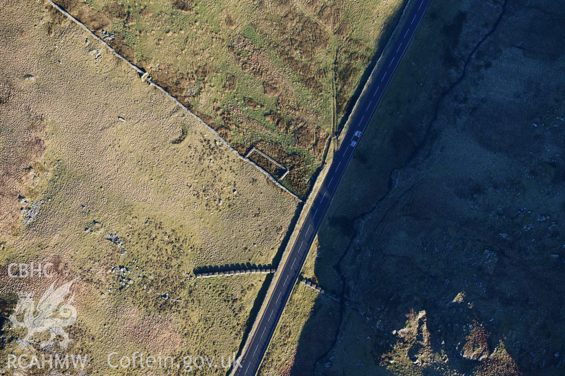 Oblique aerial photograph of Bwlch Oerddrws anti-tank blocks taken during the Royal Commission’s programme of archaeological aerial reconnaissance by Toby Driver on 17th January 2022