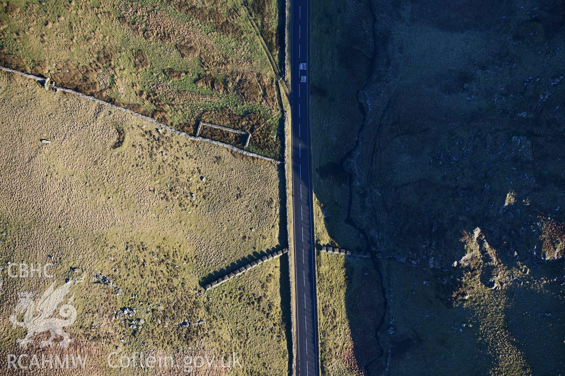 Oblique aerial photograph of Bwlch Oerddrws anti-tank blocks taken during the Royal Commission’s programme of archaeological aerial reconnaissance by Toby Driver on 17th January 2022