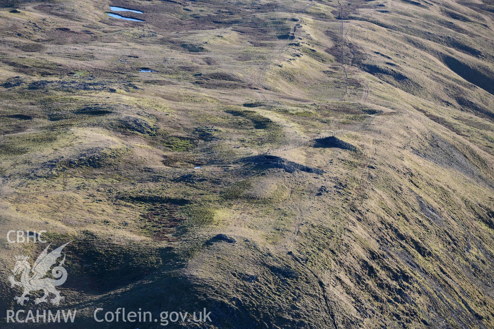 Oblique aerial photograph of Pen Plynlimon Fawr cairn cemetery. Taken during the Royal Commission’s programme of archaeological aerial reconnaissance by Toby Driver on 17th January 2022