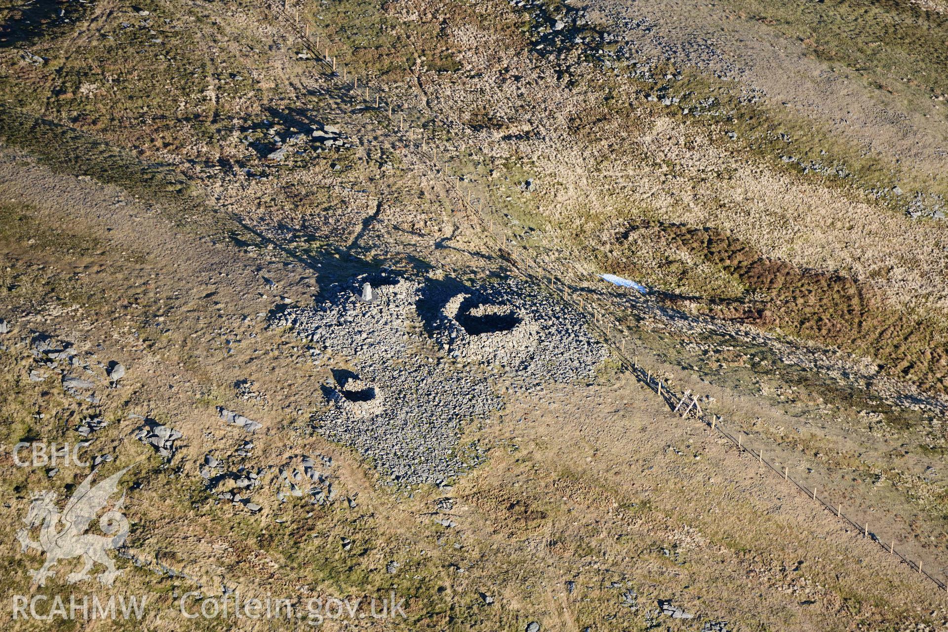 Oblique aerial photograph of the central cairn at Pen Plynlimon Fawr cairn cemetery. Taken during the Royal Commission’s programme of archaeological aerial reconnaissance by Toby Driver on 17th January 2022