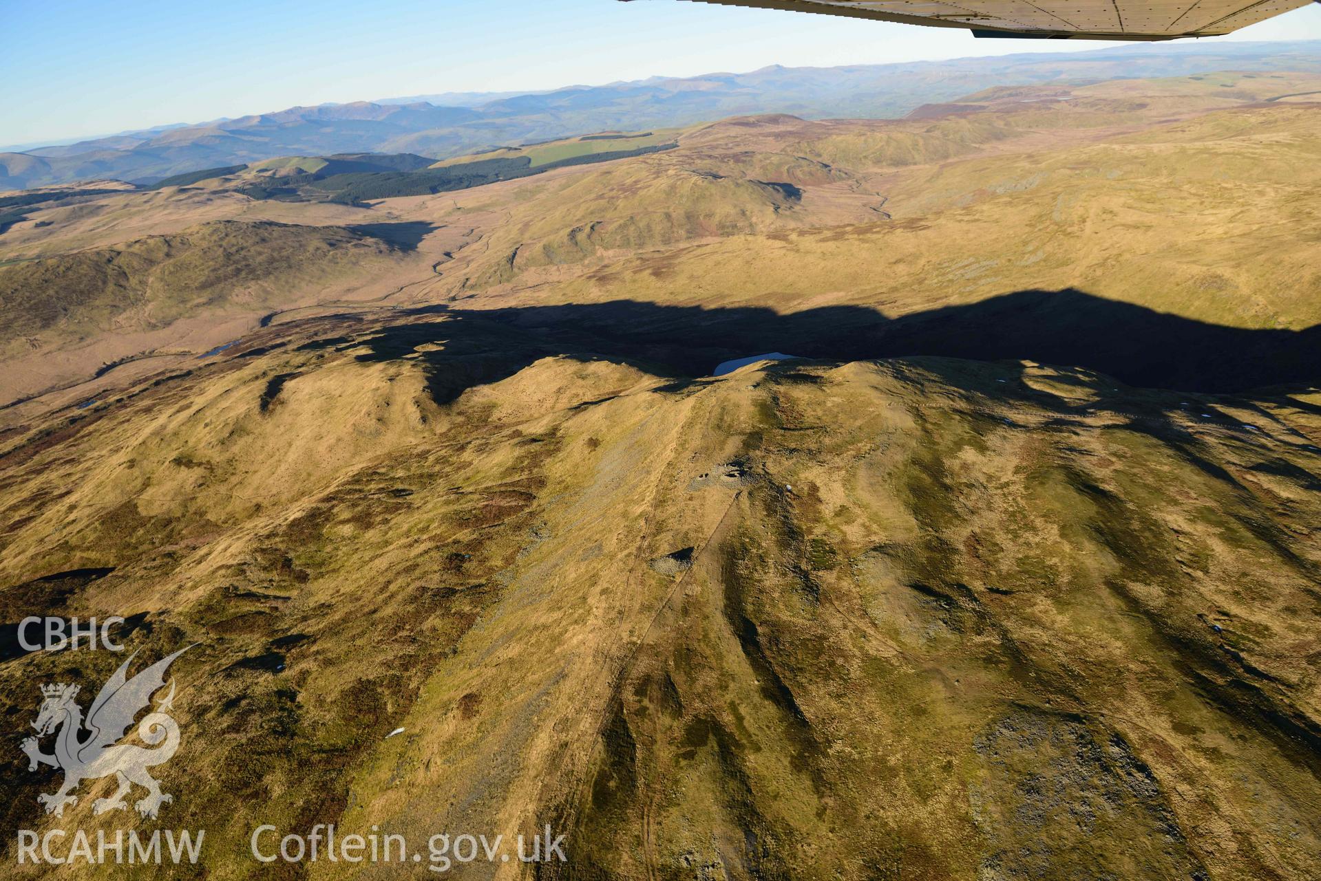 Oblique aerial photograph showing view from the south of Pen Plynlimon Fawr cairn cemetery. Taken during the Royal Commission’s programme of archaeological aerial reconnaissance by Toby Driver on 17th January 2022