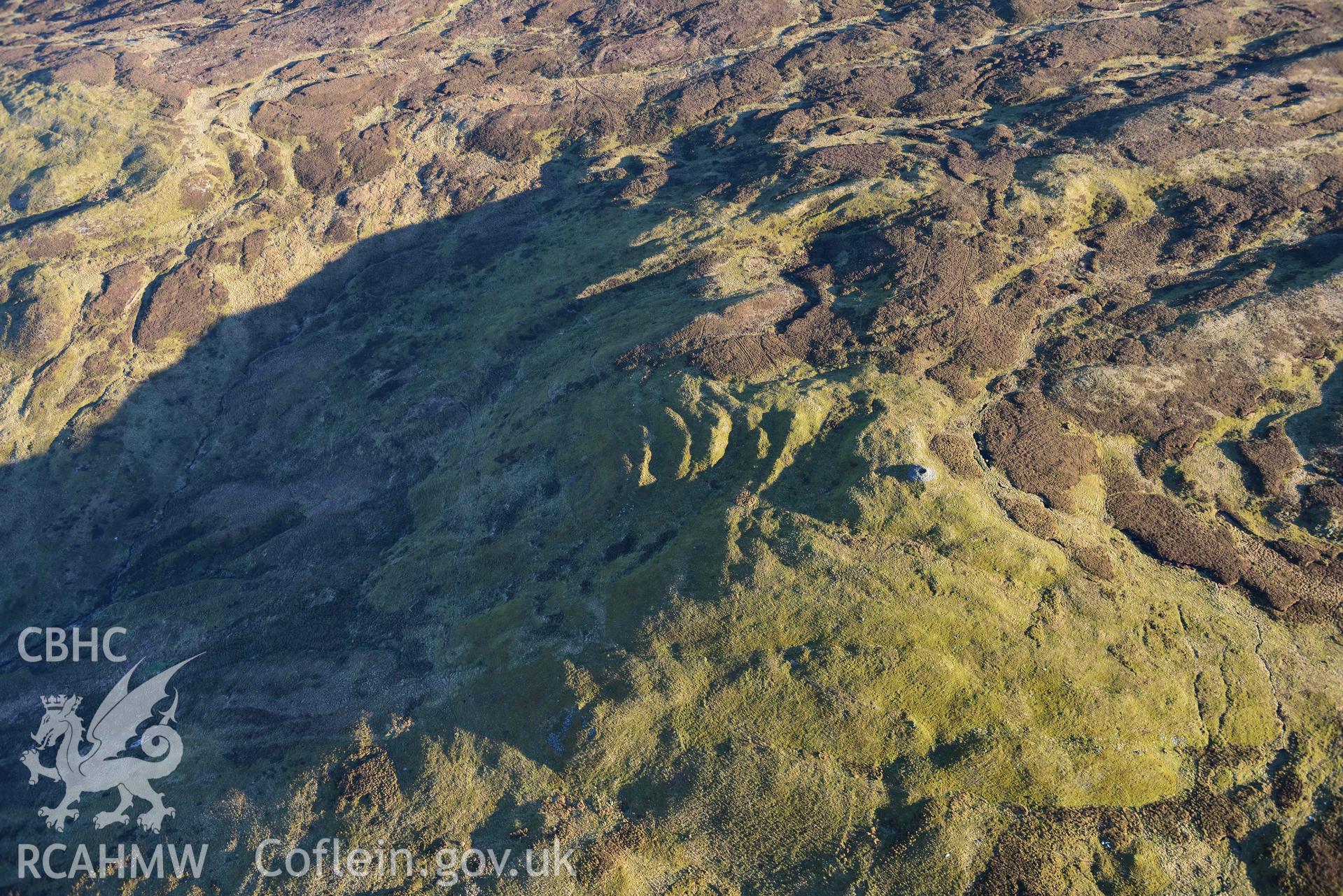 Oblique aerial photograph of Carn Fawr cairns taken during the Royal Commission’s programme of archaeological aerial reconnaissance by Toby Driver on 17th January 2022