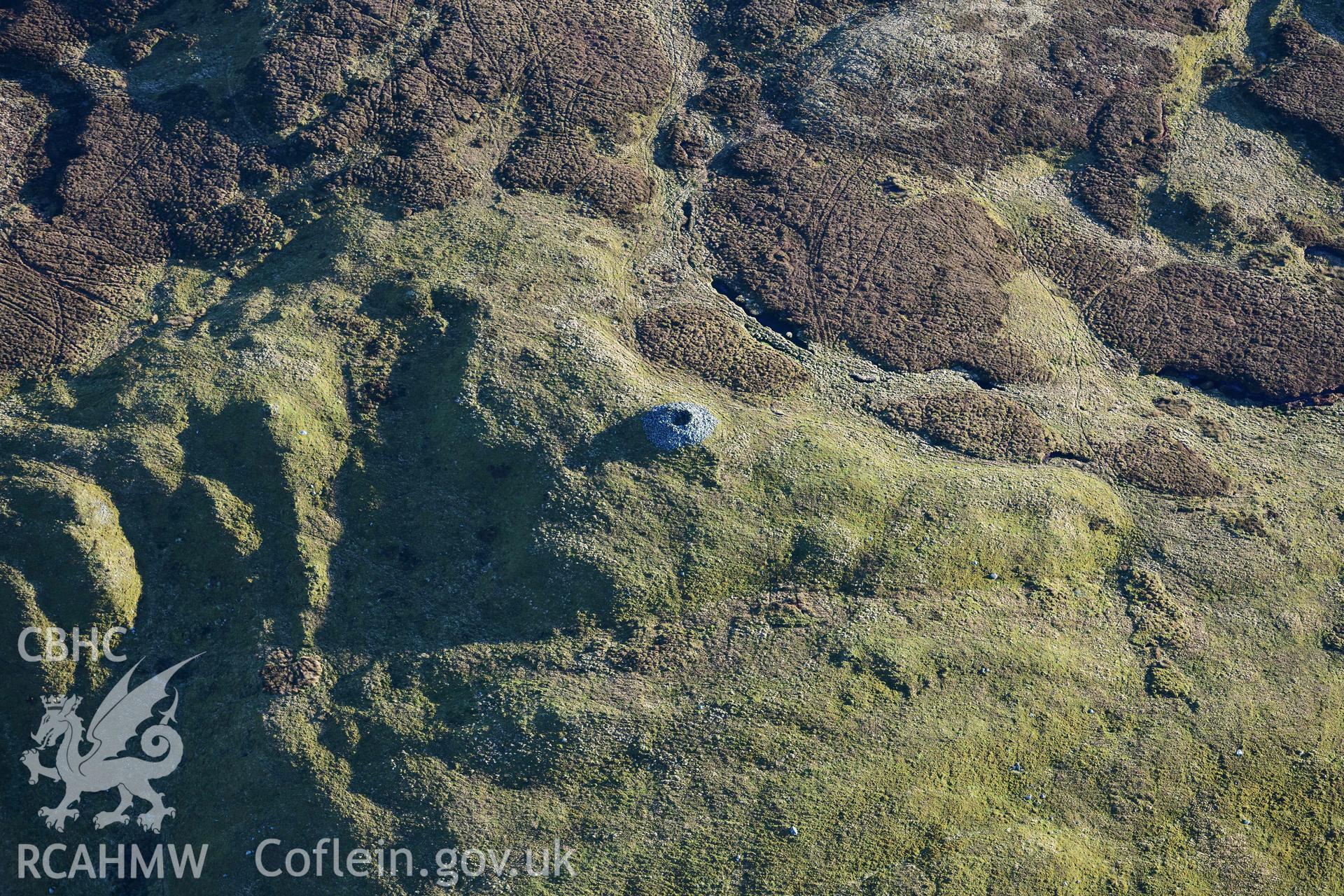 Oblique aerial photograph of Carn Fawr cairns taken during the Royal Commission’s programme of archaeological aerial reconnaissance by Toby Driver on 17th January 2022