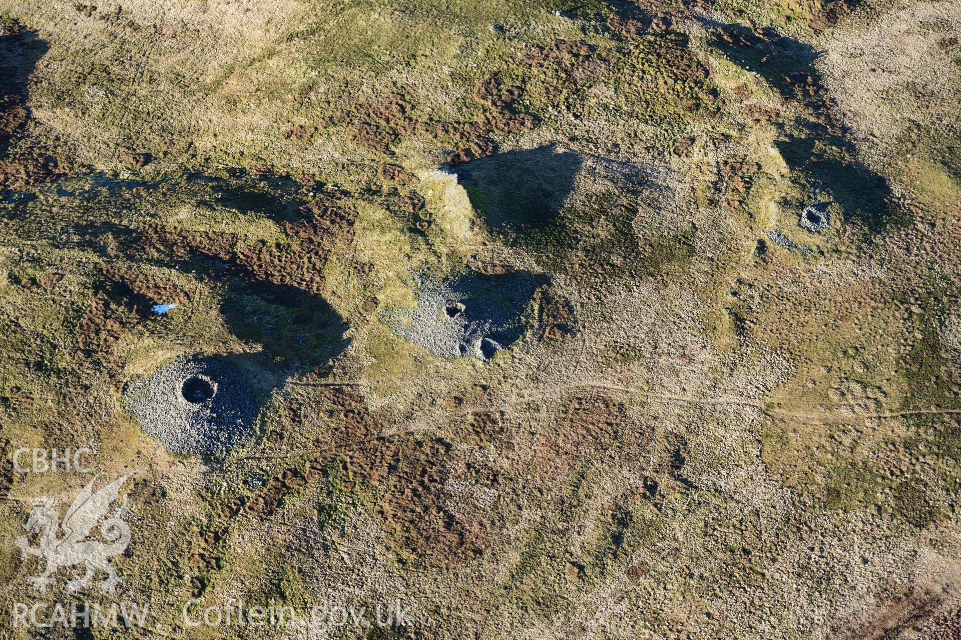 Oblique aerial photograph of Pen Pumlumon Arwystli cairn cemetery. Taken during the Royal Commission’s programme of archaeological aerial reconnaissance by Toby Driver on 17th January 2022