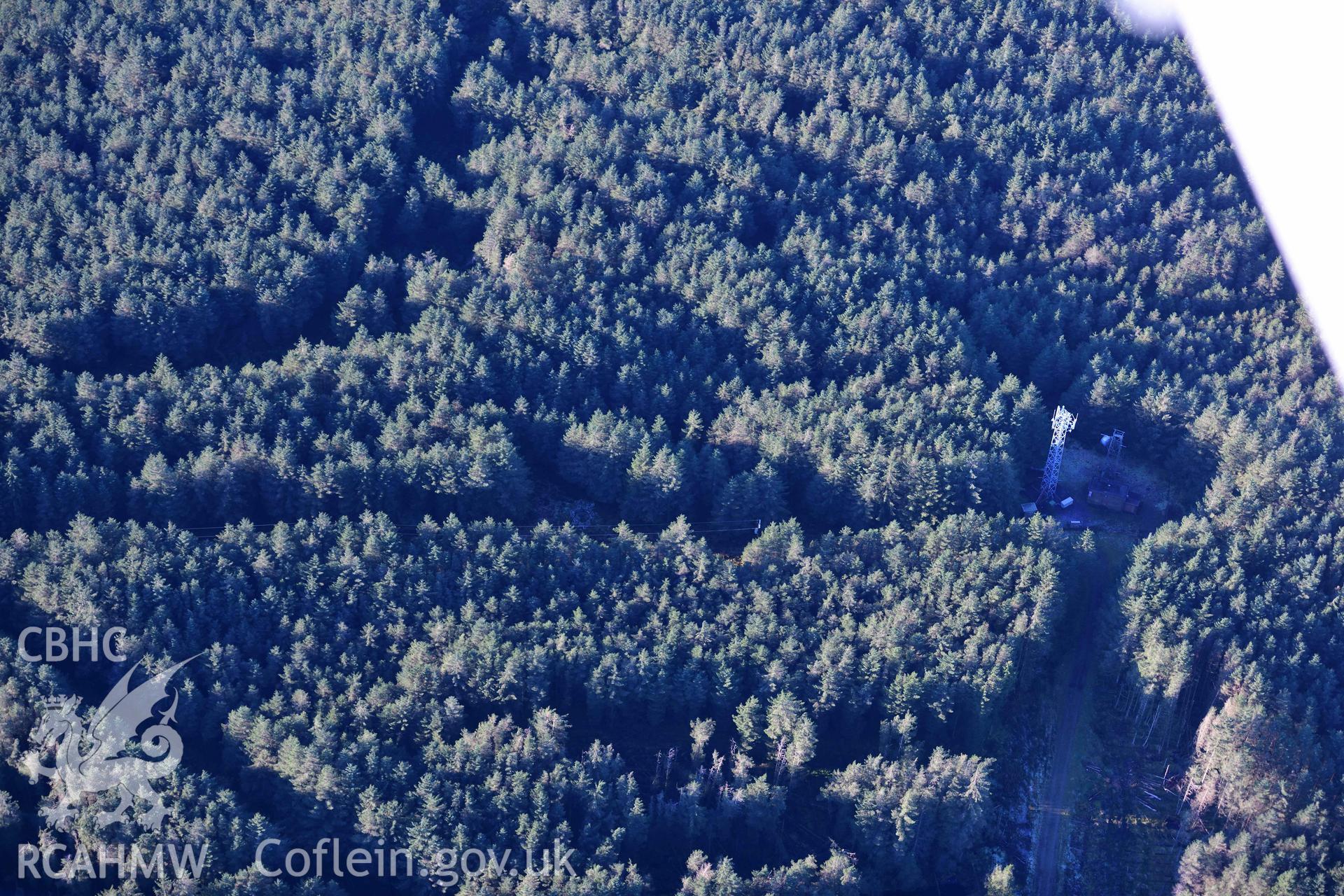 Oblique aerial photograph showing view from the east of Carn Bwlch y Cloddiau. Taken during the Royal Commission’s programme of archaeological aerial reconnaissance by Toby Driver on 17th January 2022