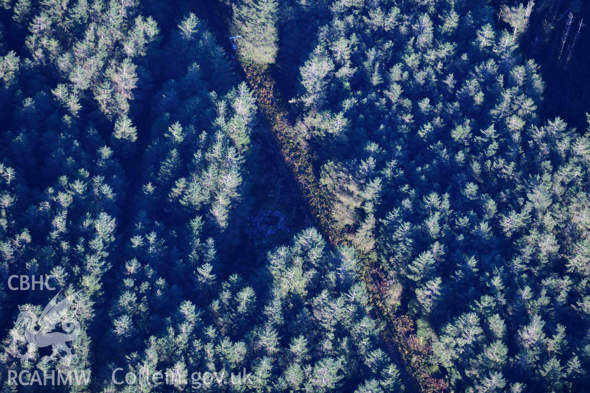 Oblique aerial photograph showing view from the east of Carn Bwlch y Cloddiau. Taken during the Royal Commission’s programme of archaeological aerial reconnaissance by Toby Driver on 17th January 2022