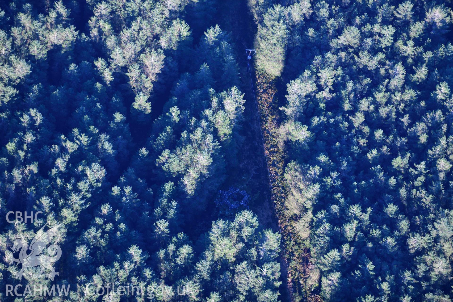 Oblique aerial photograph showing view from the east of Carn Bwlch y Cloddiau. Taken during the Royal Commission’s programme of archaeological aerial reconnaissance by Toby Driver on 17th January 2022