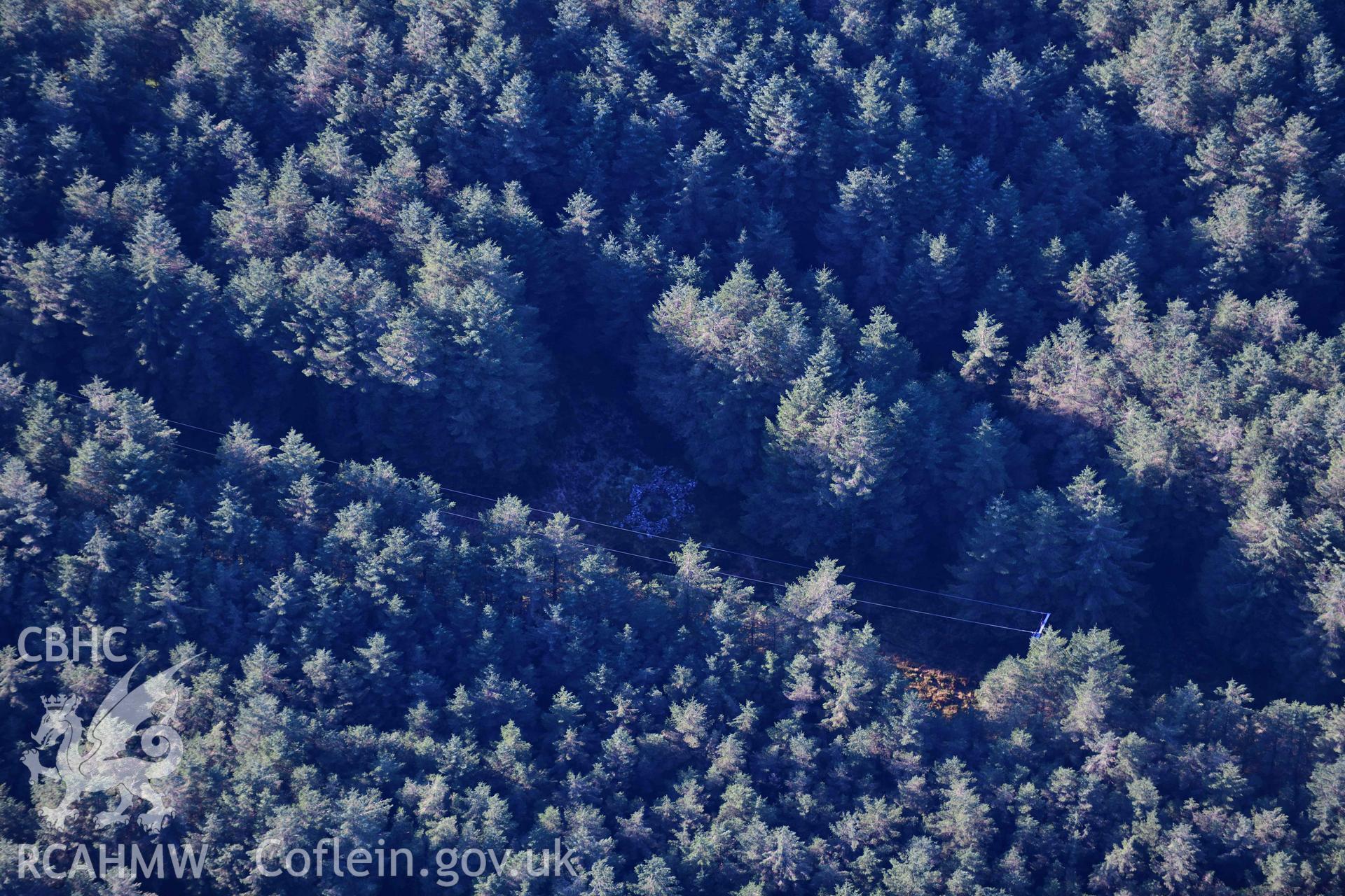 Oblique aerial photograph showing view from the east of Carn Bwlch y Cloddiau. Taken during the Royal Commission’s programme of archaeological aerial reconnaissance by Toby Driver on 17th January 2022